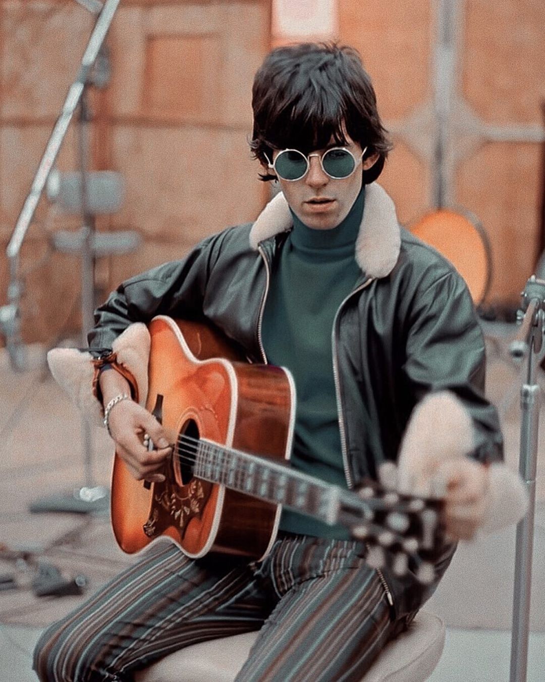 Keith Richards of The Rolling Stones tunes his Hummingbird acoustic