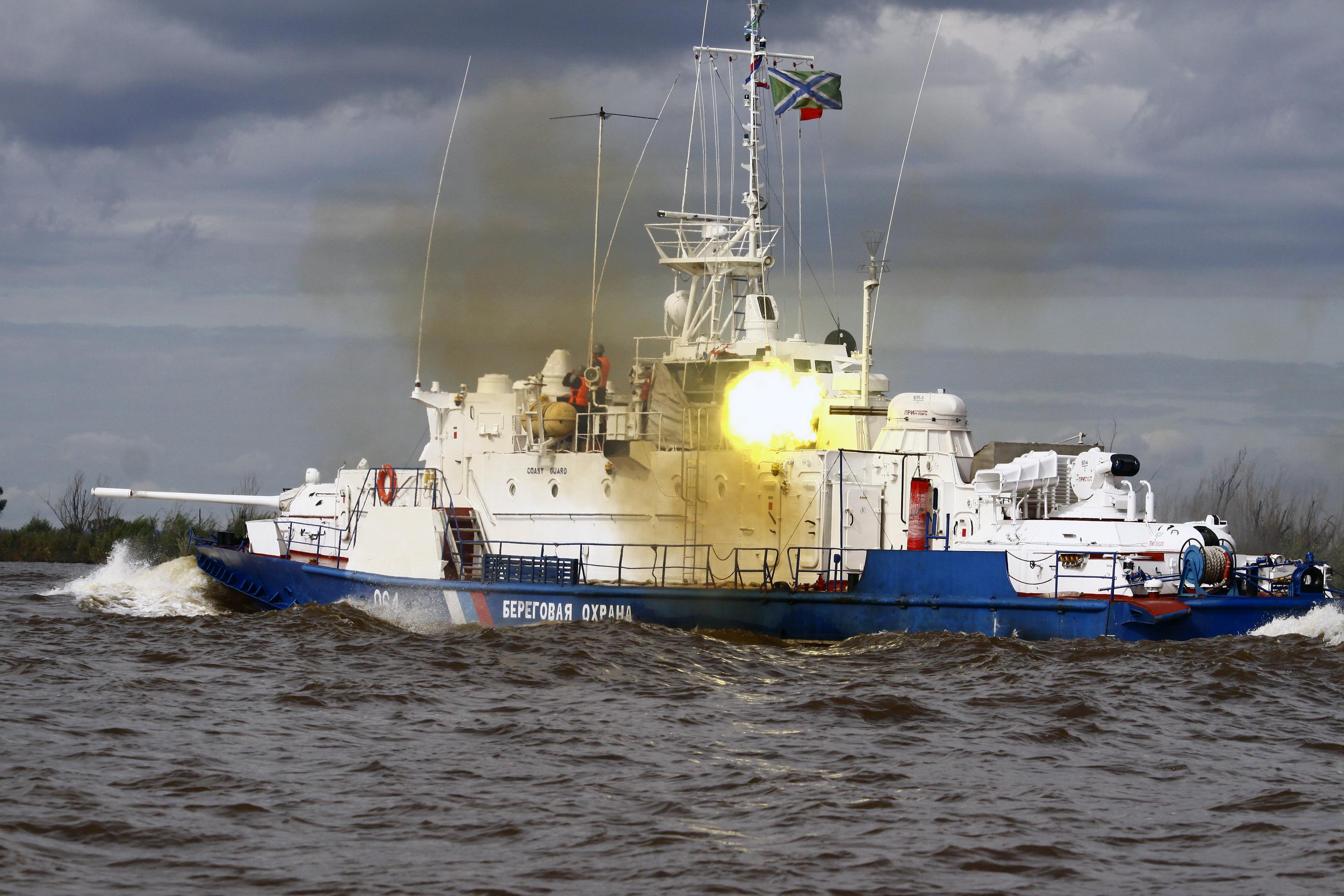 Russian Coast Guard Project 1248 Moskit patrol boat firing its AK306