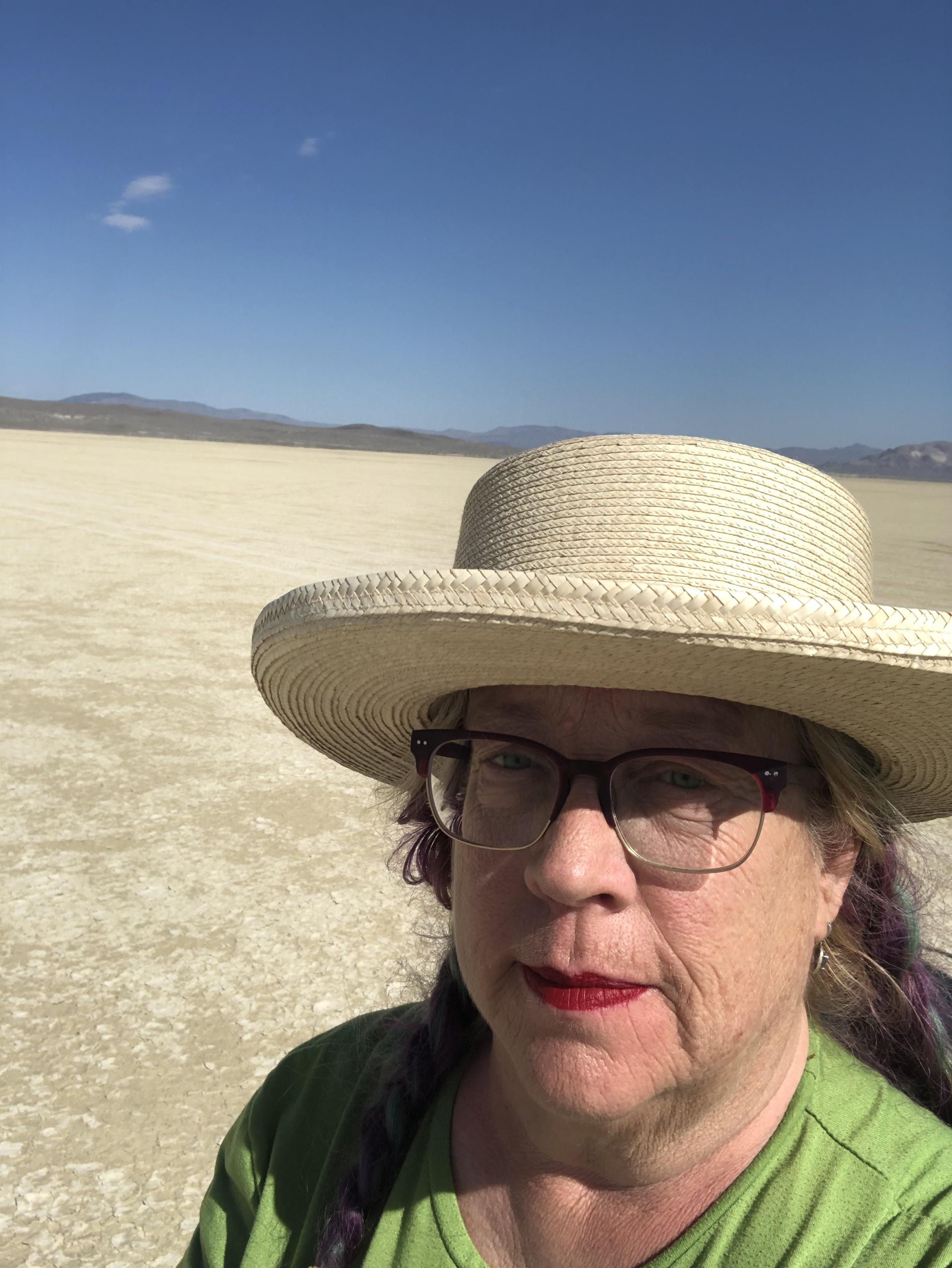 I lost my hat. It’s giant and it won’t fit you. It blew away off my