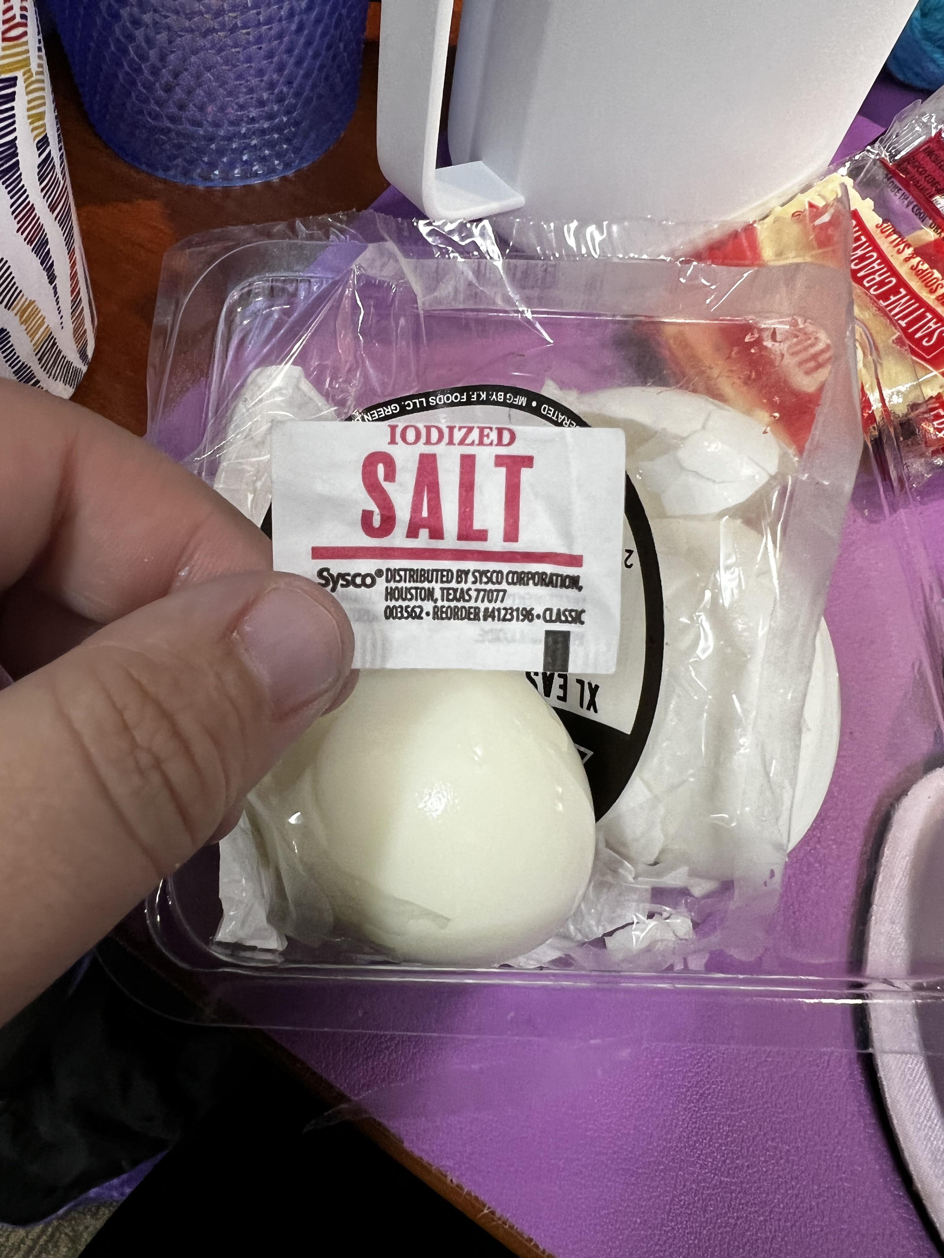 Unopened salt packet from this package of hard boiled eggs is empty. No