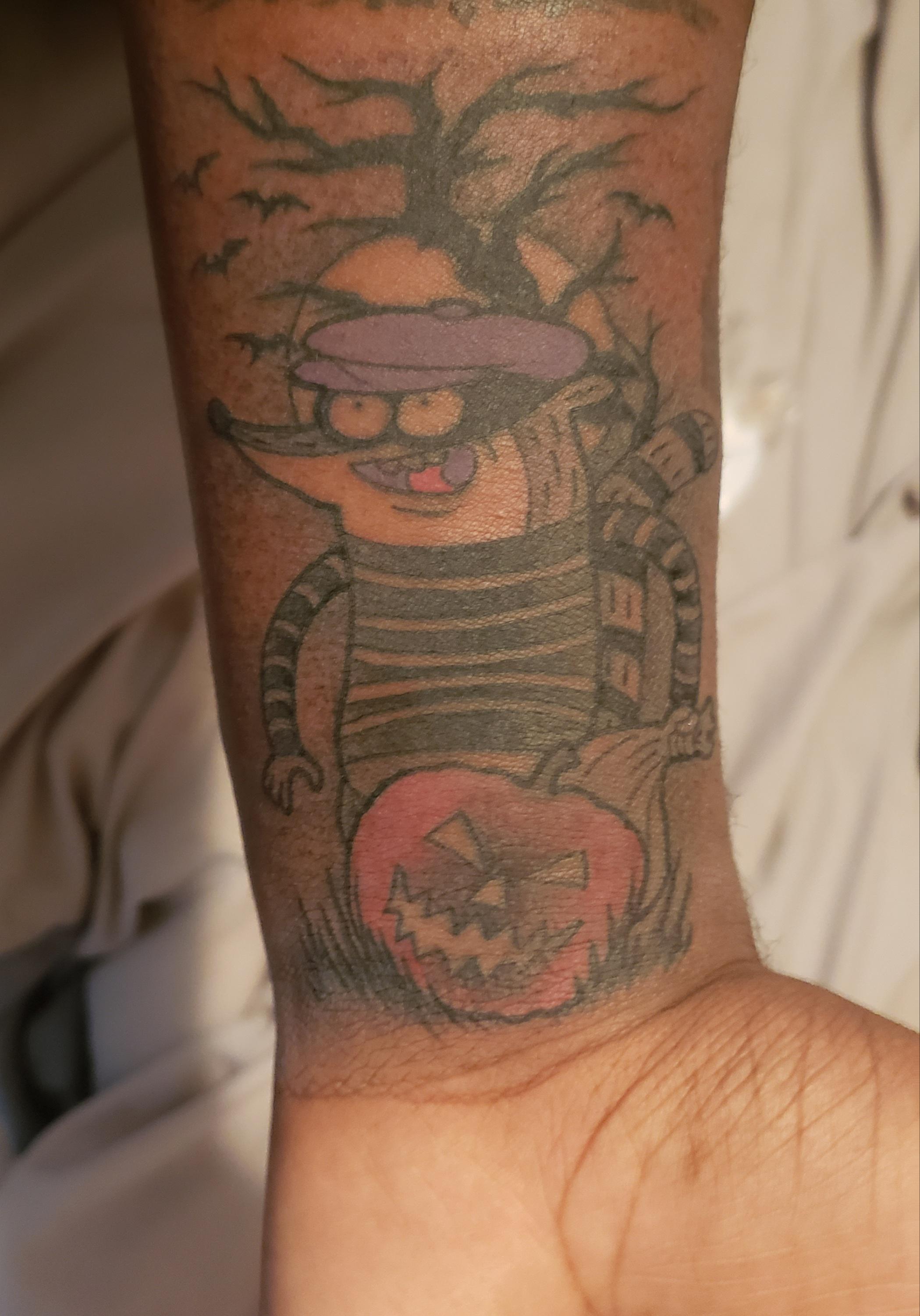 My Rigby tattoo, just in time for spooky season r/regularshow