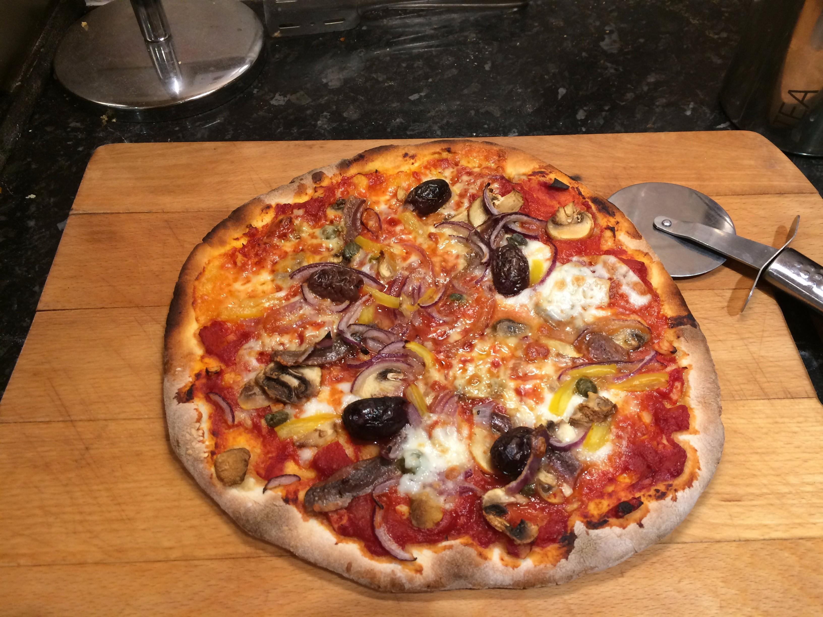 Homemade Pizza with anchovies, olives, mushrooms and capers r/Pizza