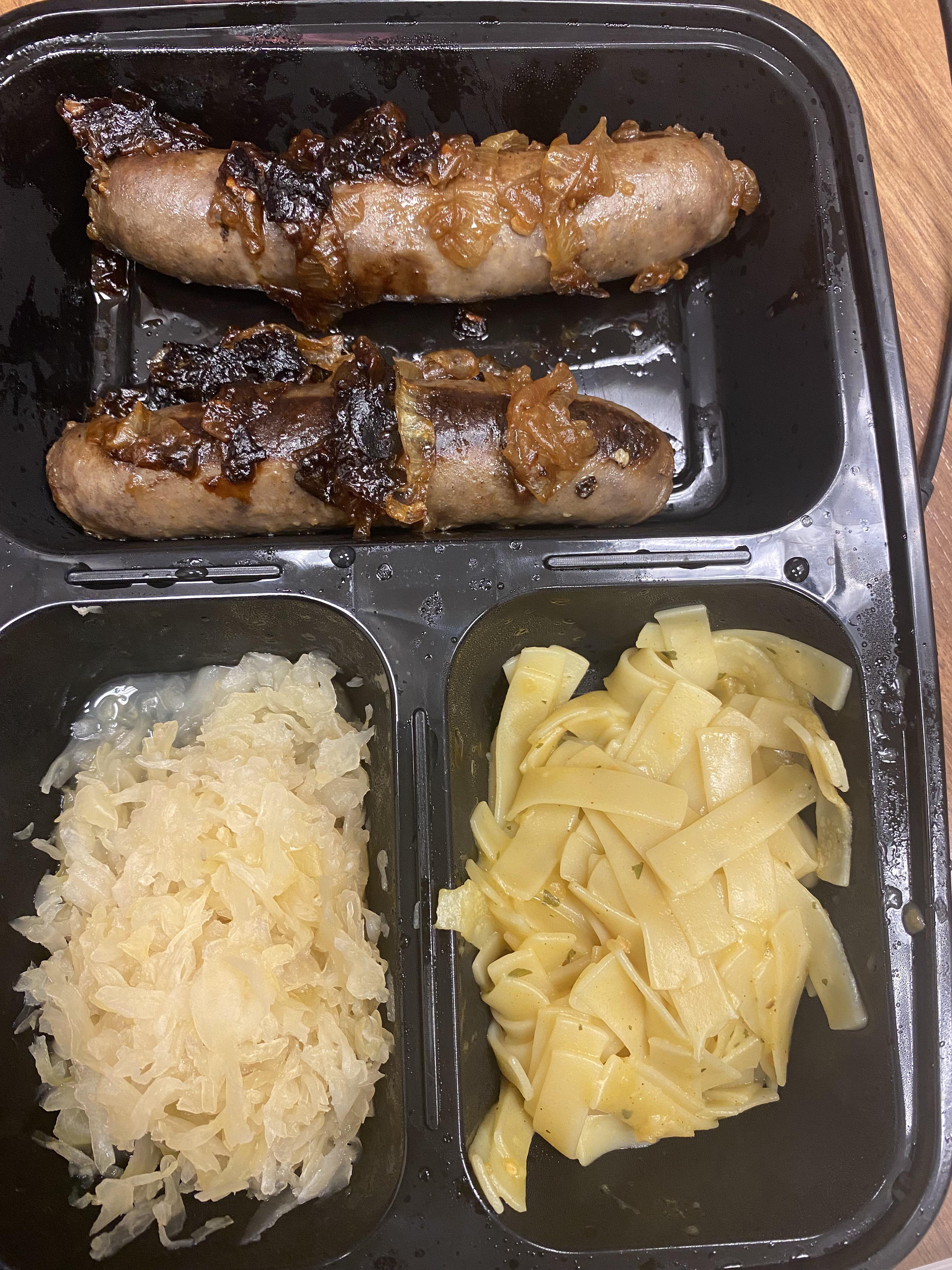 Venison bratwurst with caramelized onions, sauerkraut, noodles. r