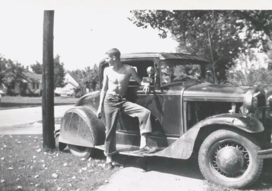 My Grandpa ("Sonny") and his first car, a 1930 Ford Model A. Newton, IA