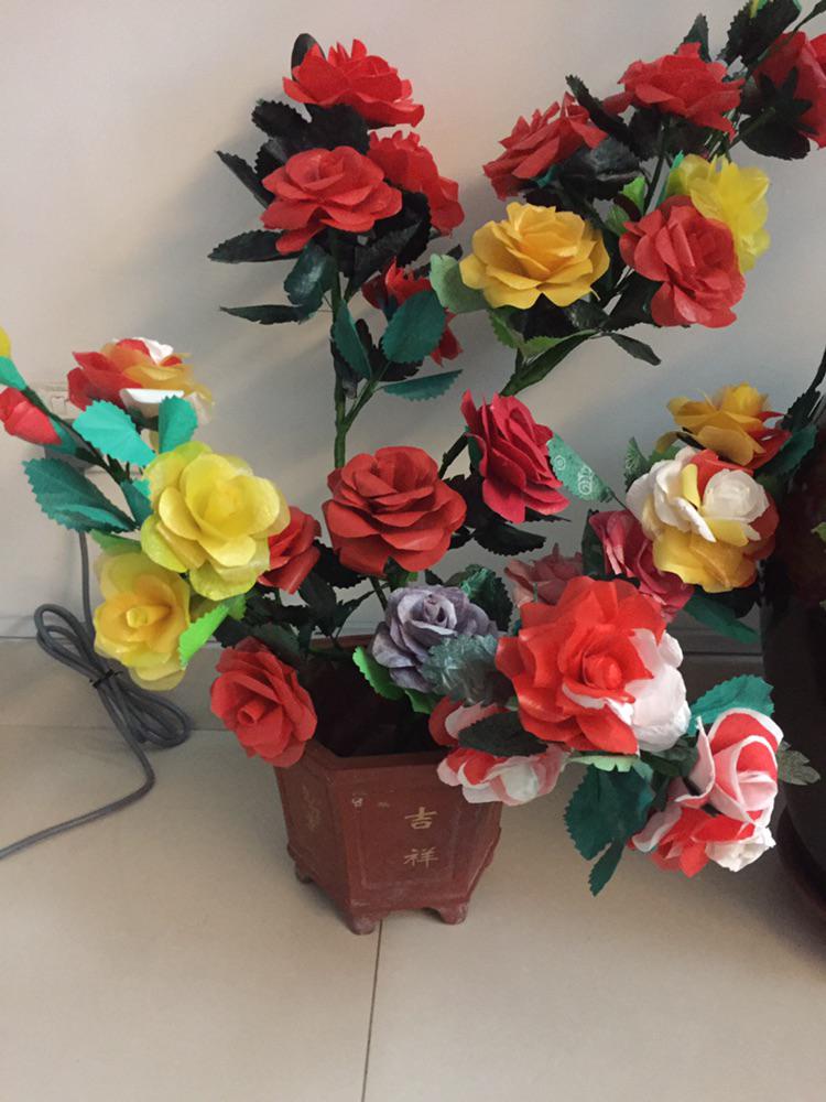 my grandmother made these flowers out of recycled plastic bags around