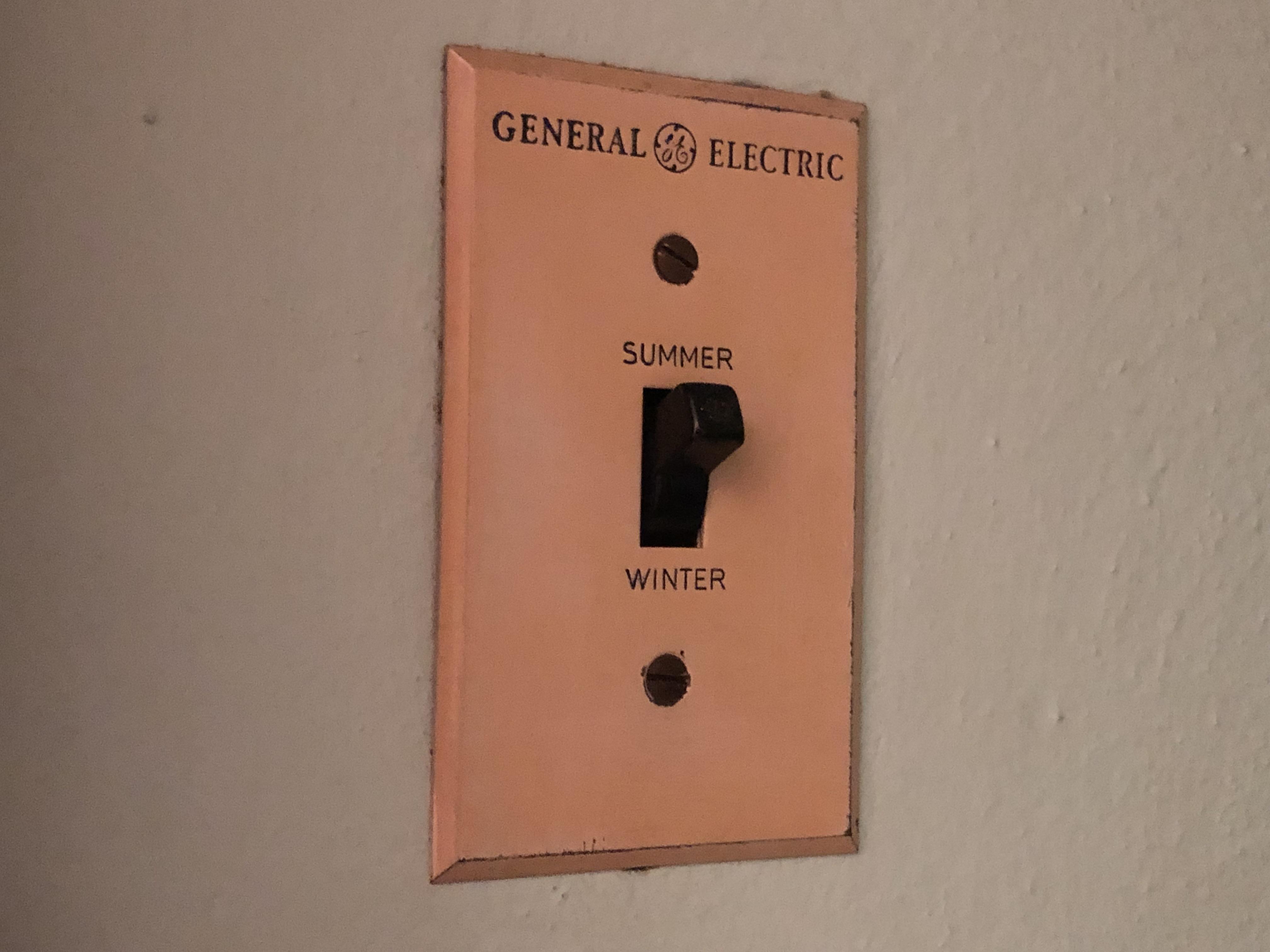 Can't figure out what this Summer/Winter wall switch does. Any ideas