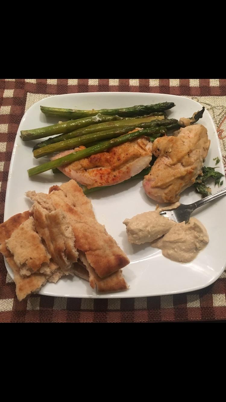 Hummus crusted chicken and asparagus with whole wheat flatbread (torn