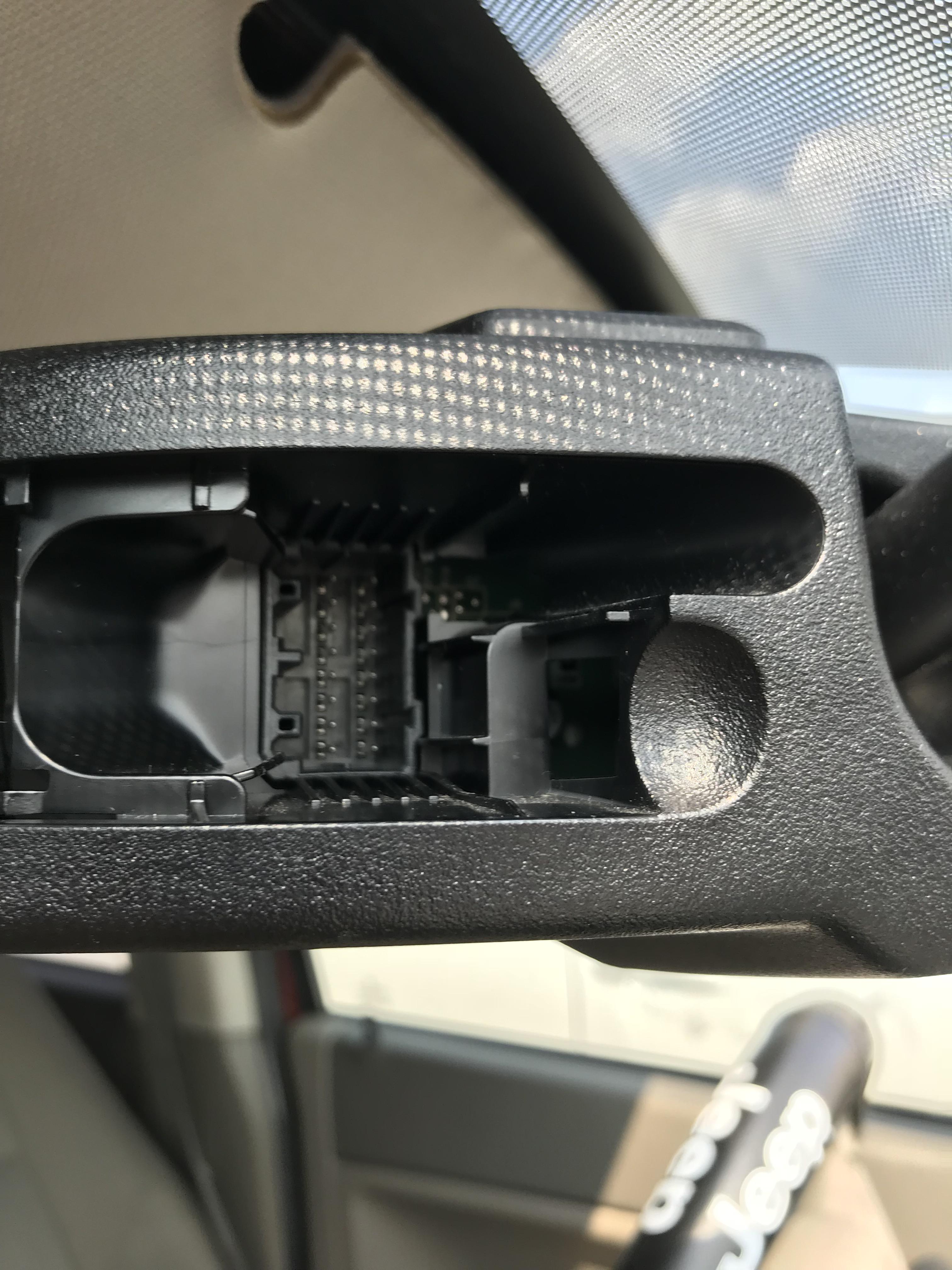 Found on the back of a 2007 Jeep Grand Cherokee rear view mirror r