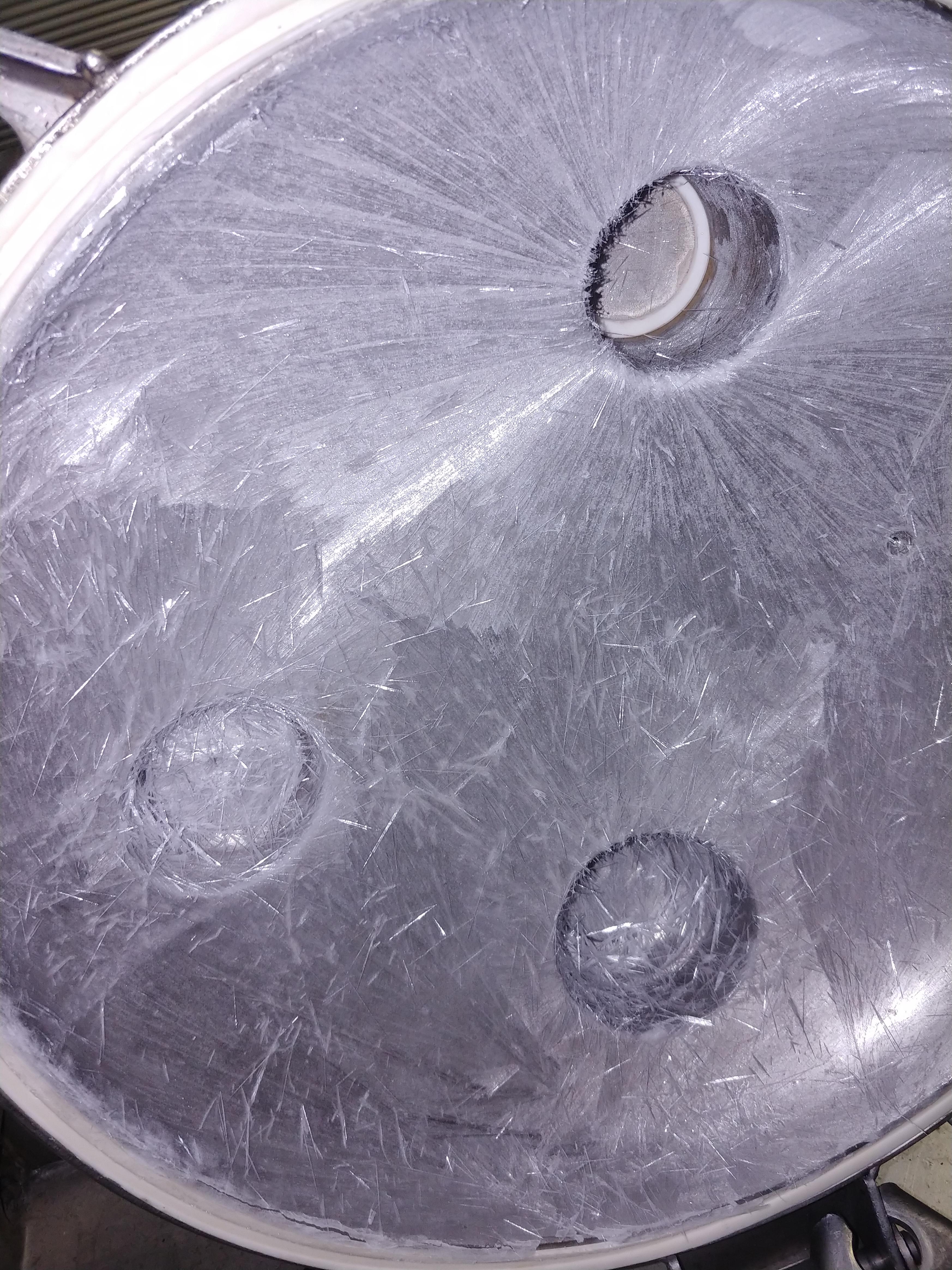 Frozen acid on a chemical tank lid. r/mildlyinteresting