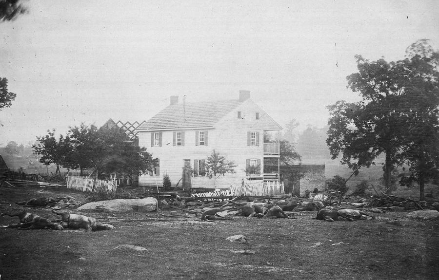 Dead horses surround the damaged Trostle House, results of the Battle of Gettysburg, in July of