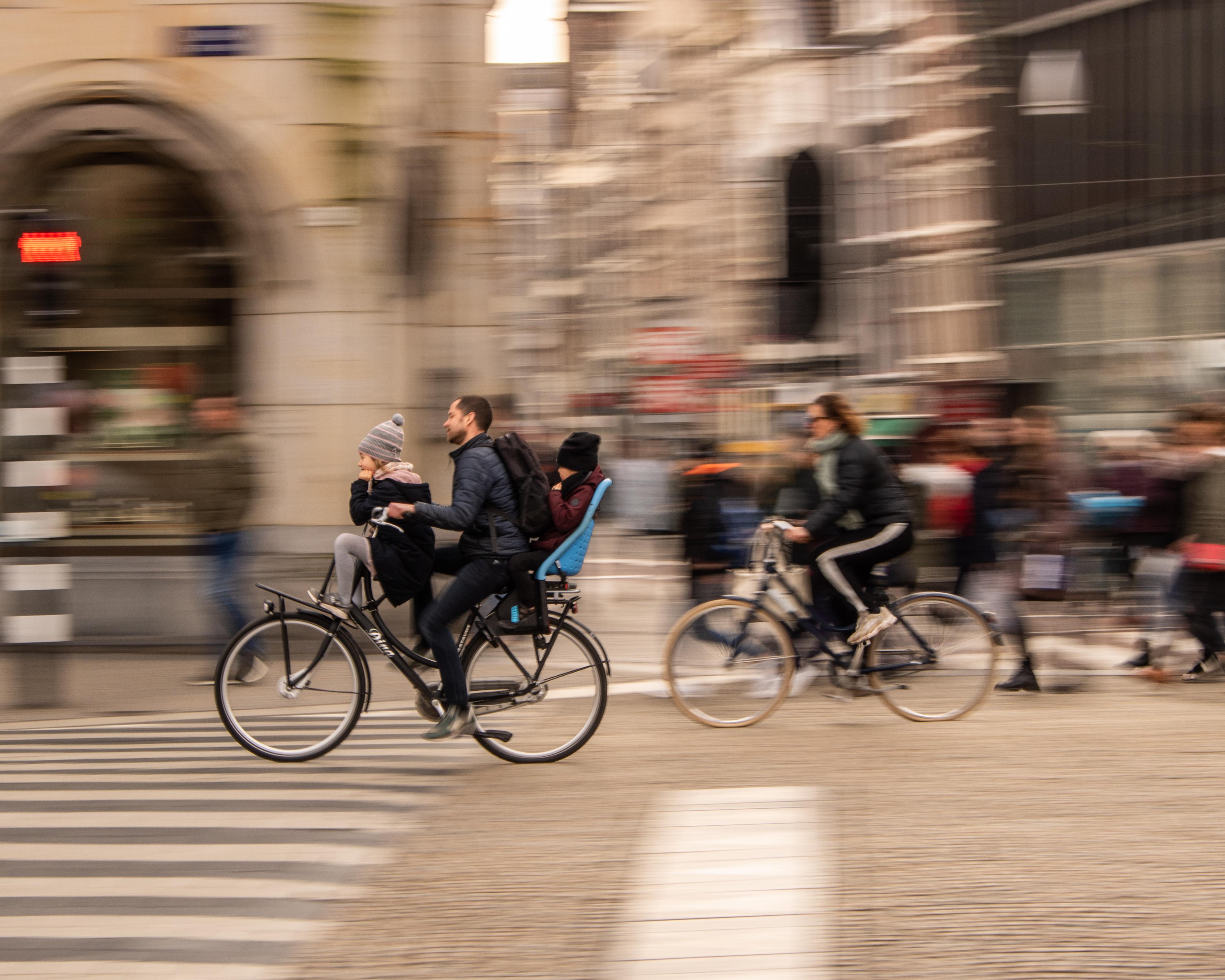 Biking through Amsterdam with the family r/pics