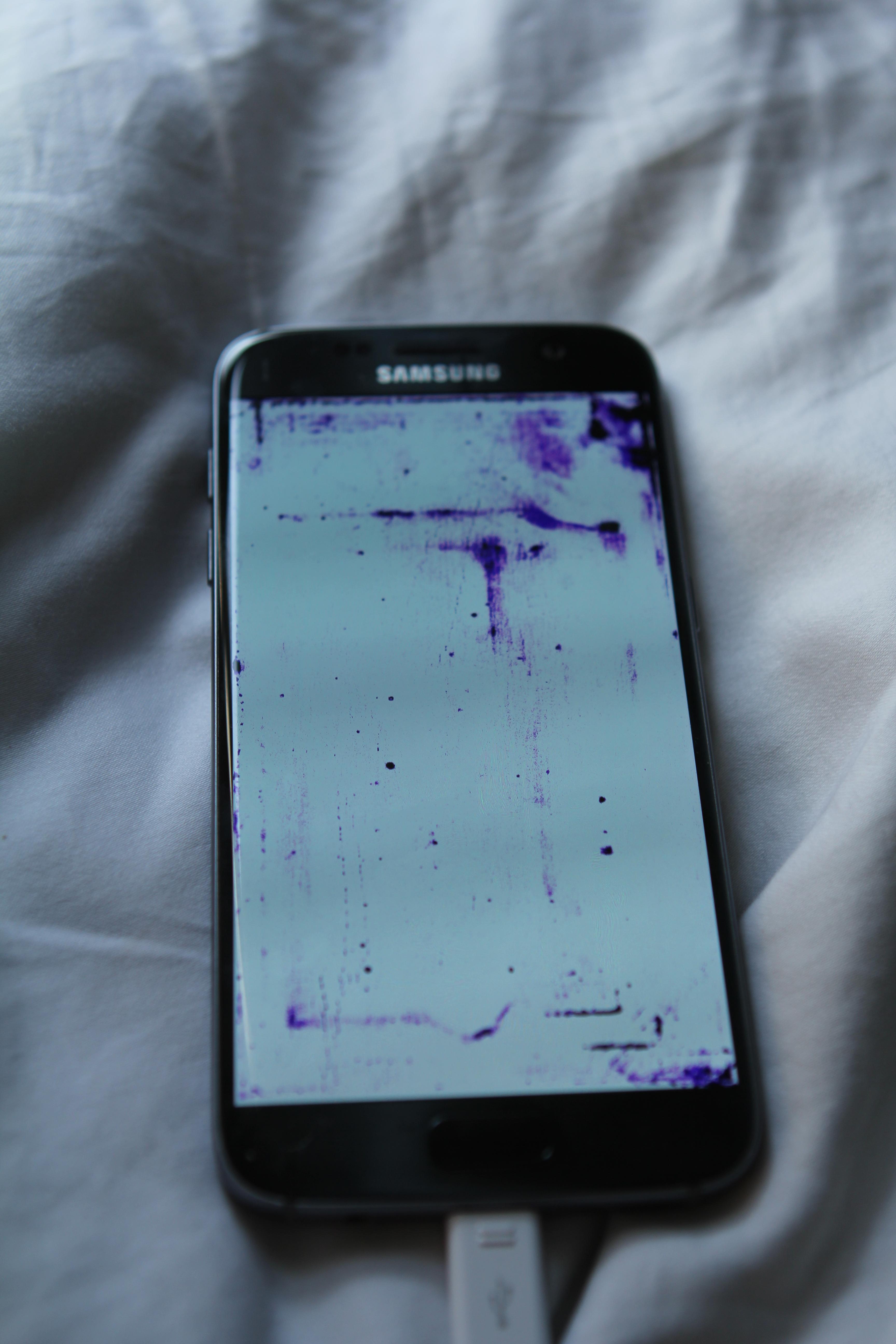 Dropped phone last night, no problems. woke up to this purple dye under