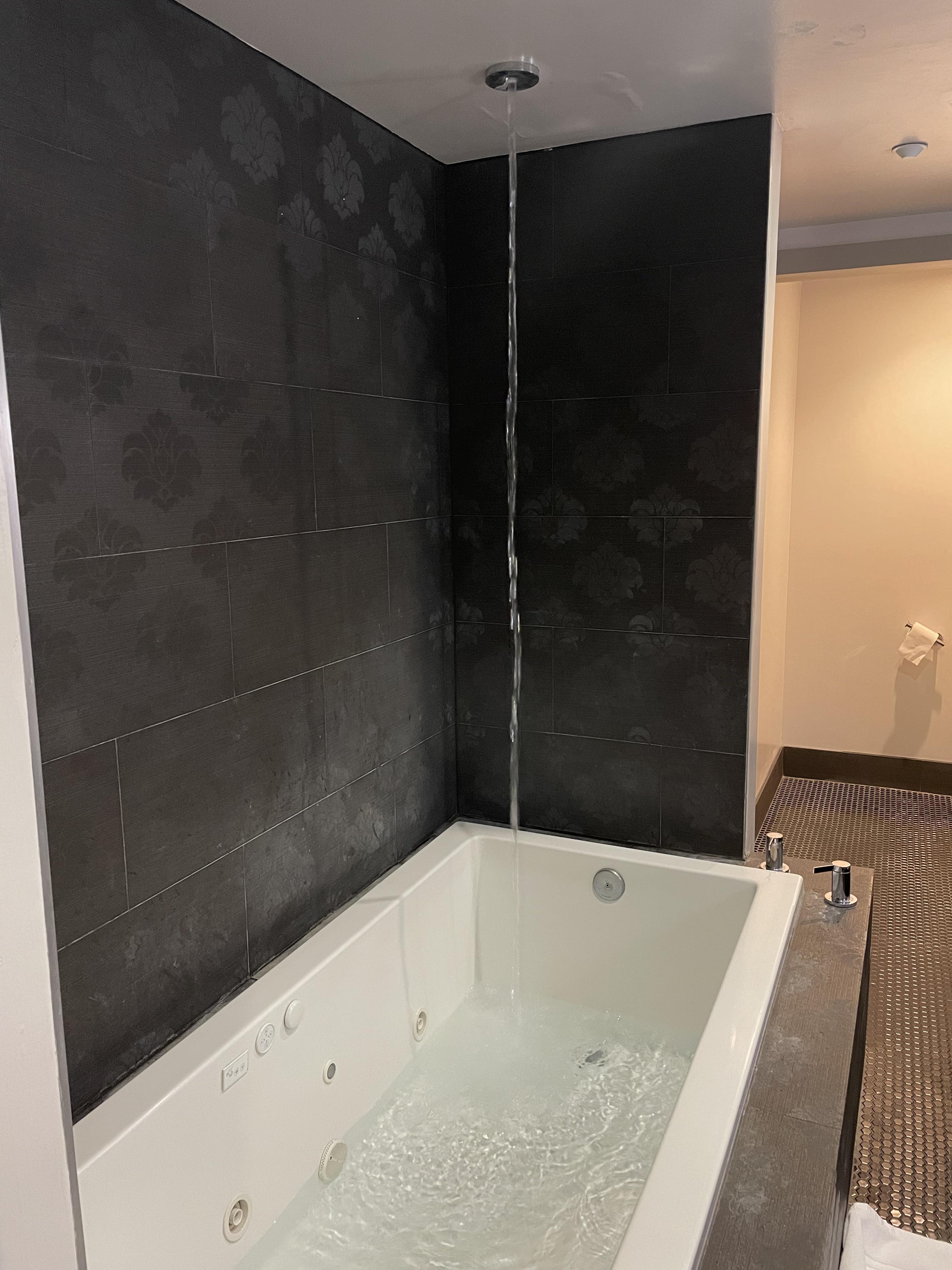 The hot tub in my hotel room fills from the ceiling. r/mildlyinteresting