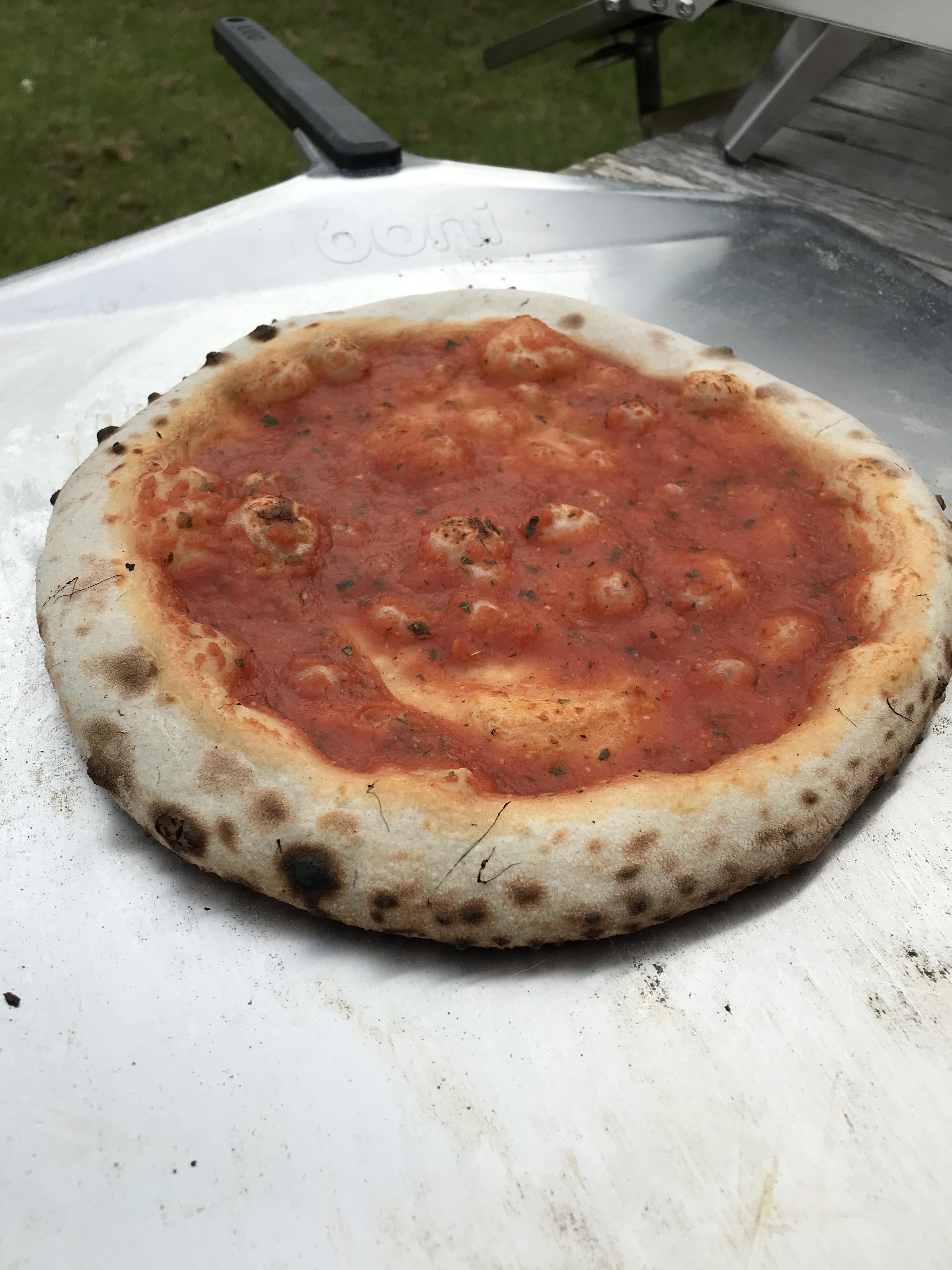 Parbake a pizza base with sauce and then freeze to heat up with