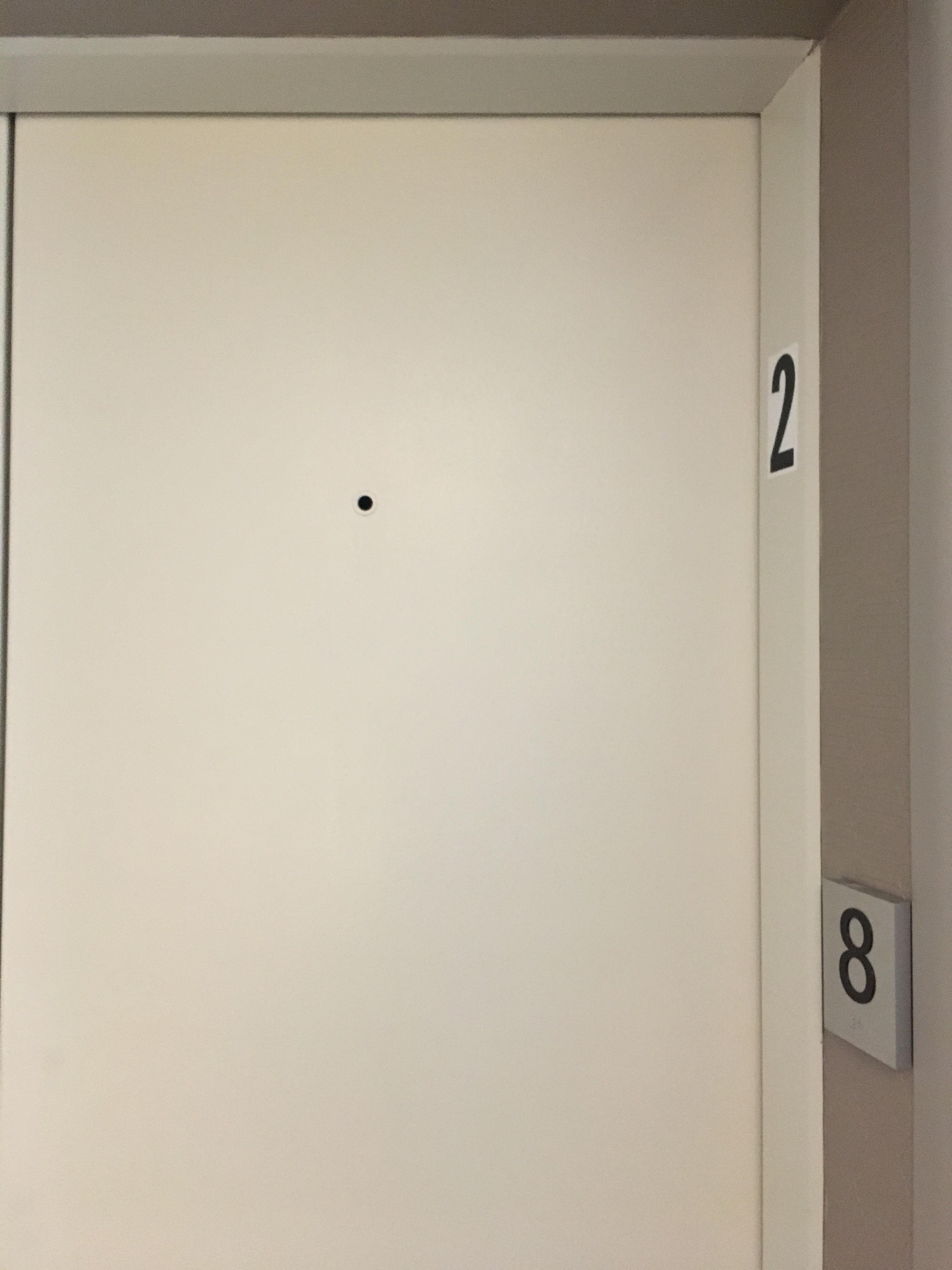 This hole on the right side of an Elevator in New Jersey, is it a peep