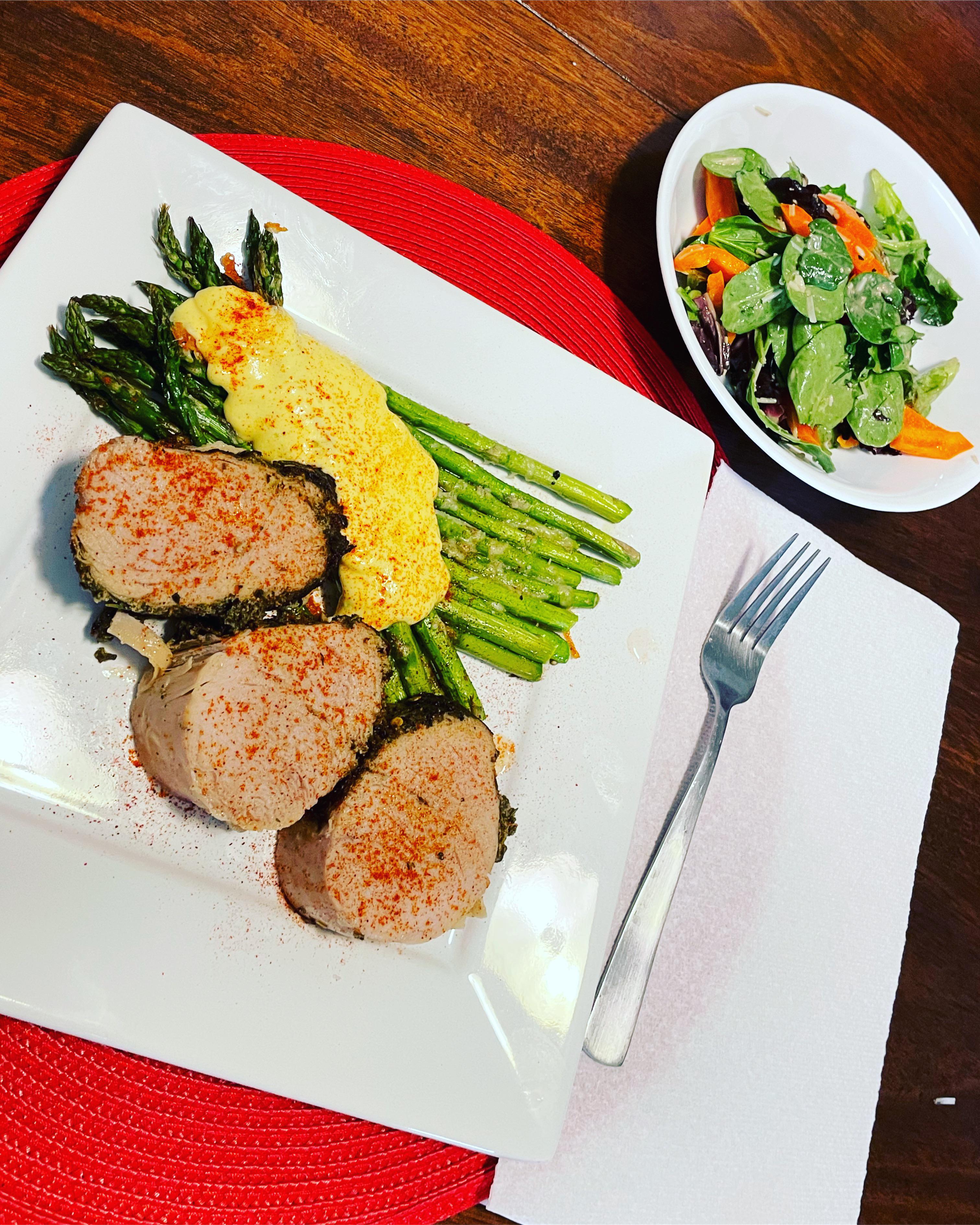 Homemade herbinfused pork loin, roasted asparagus with scratch