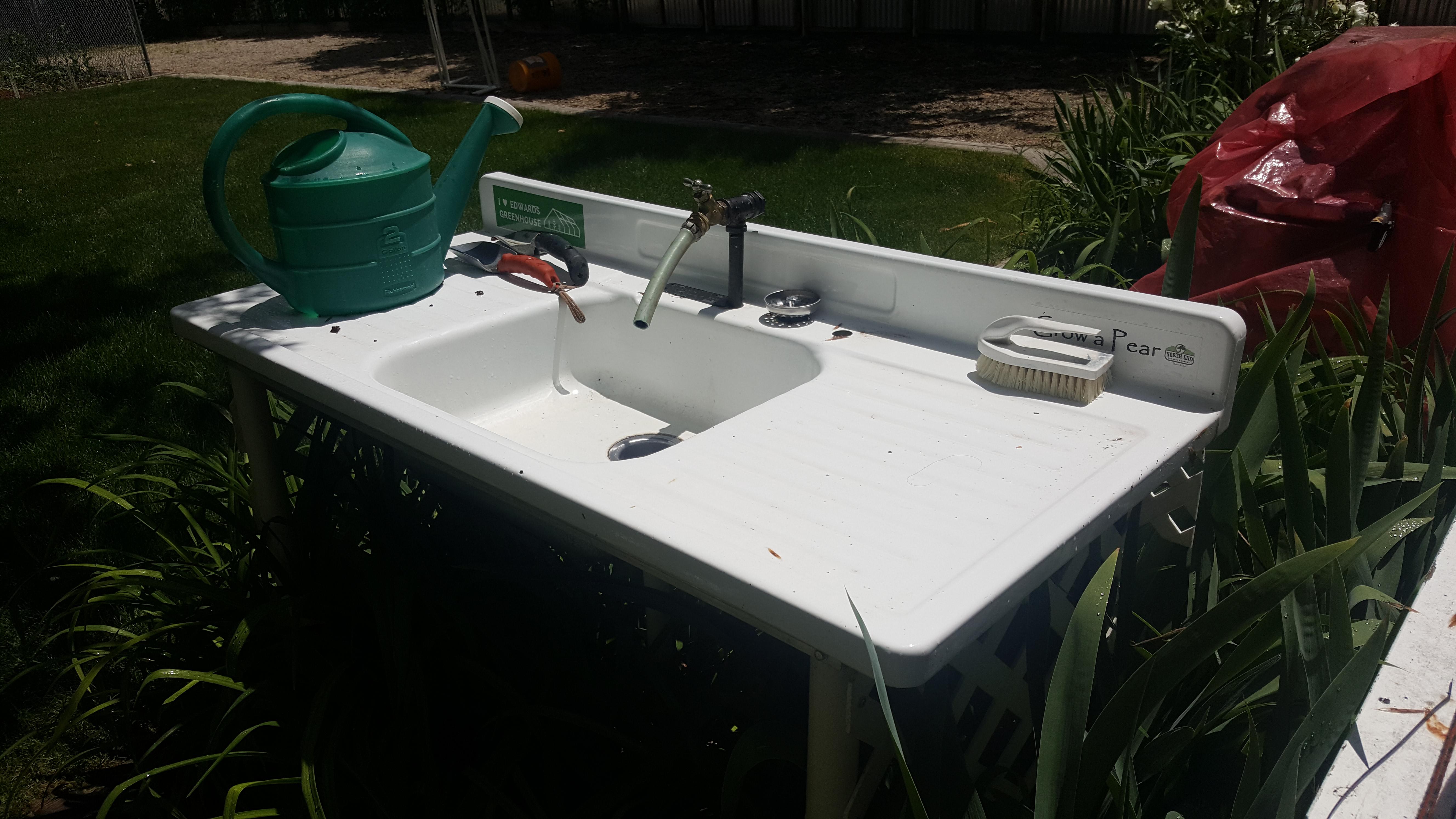 Garden sinks are the best! Salvaged kitchen sink from 1955. Drains into