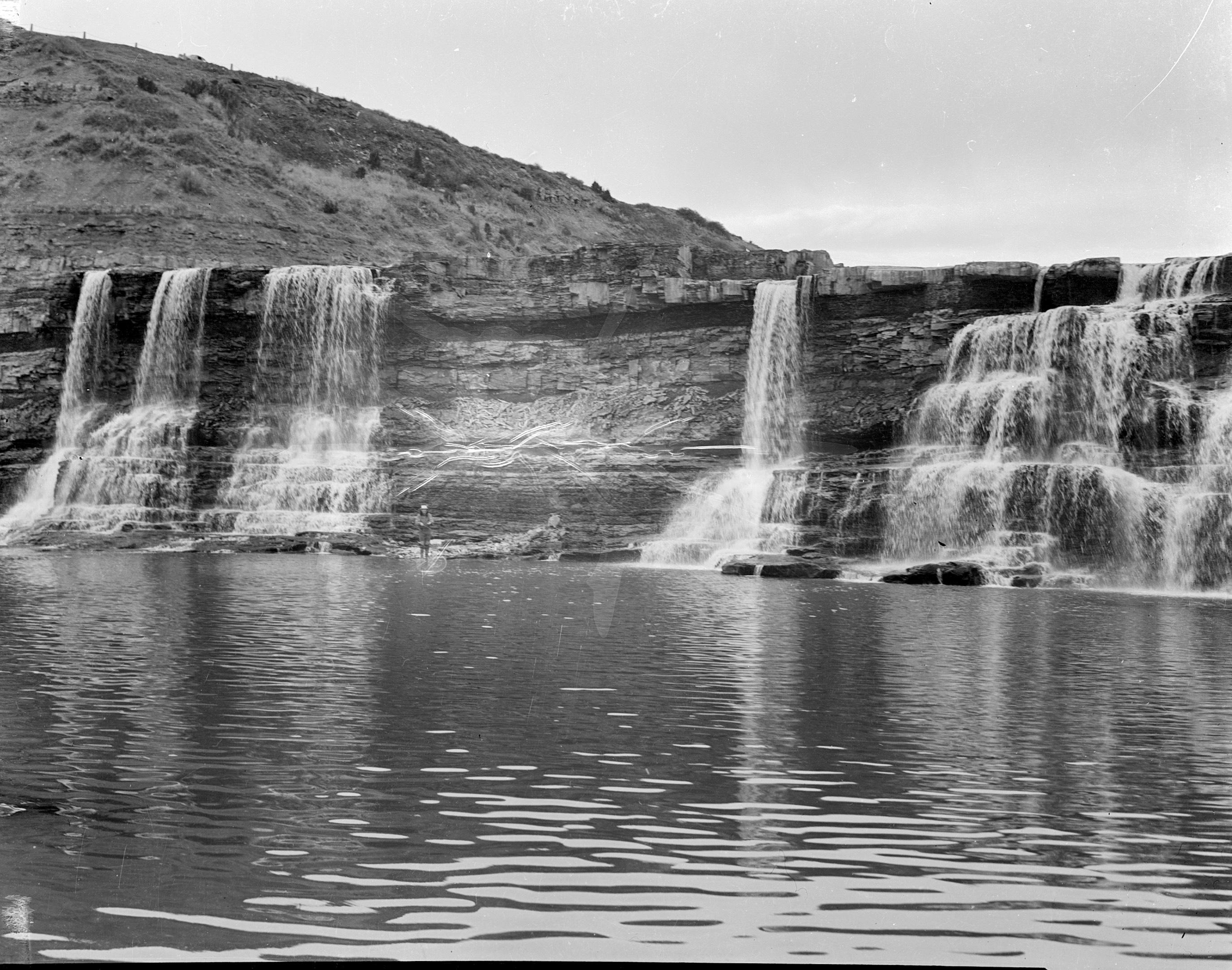 Montana, 1940s, lone fisherman at the falls below Black Eagle Dam