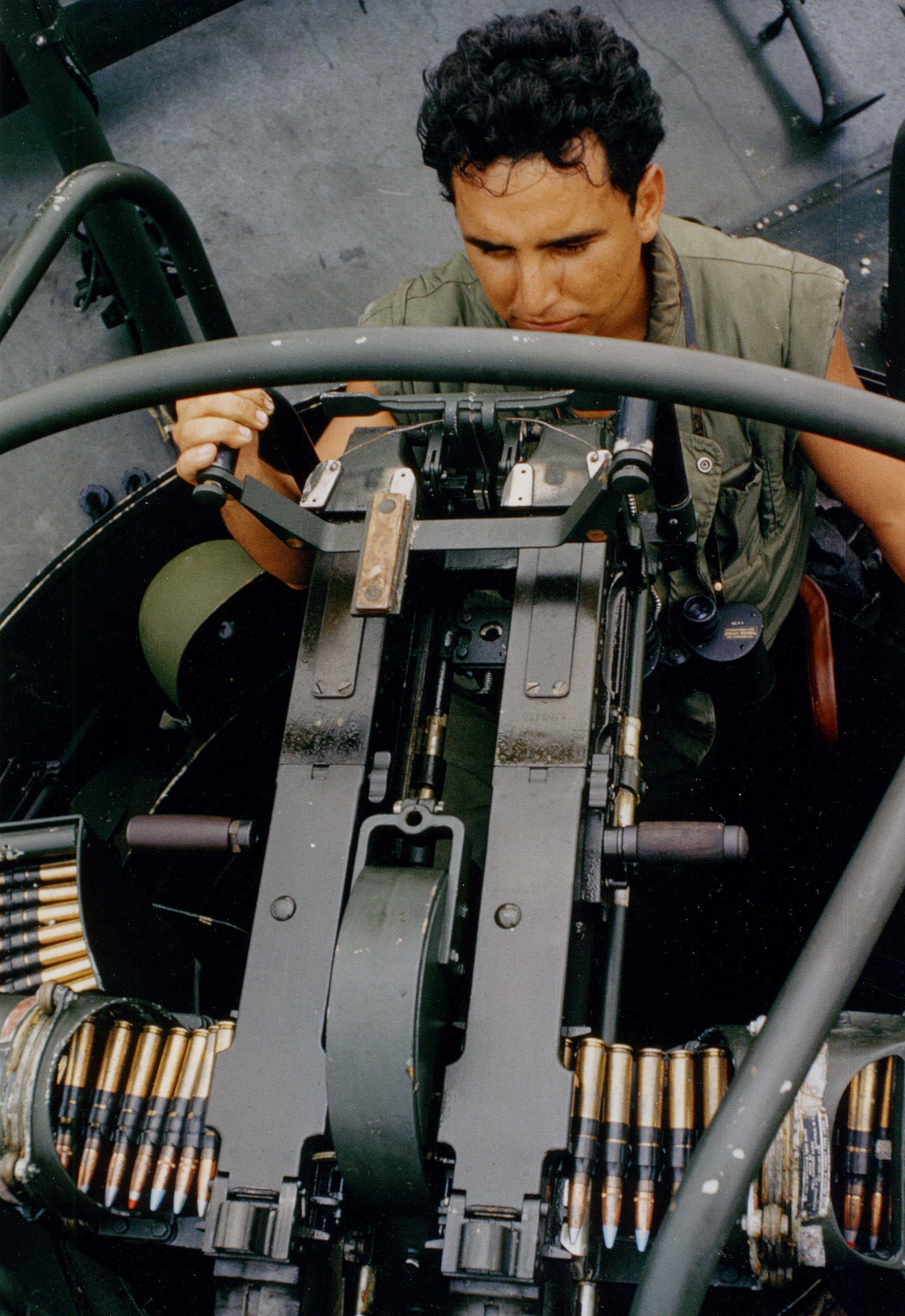 A U.S. Navy Patrol Boat River (PBR) crewman mans the forward twin .50