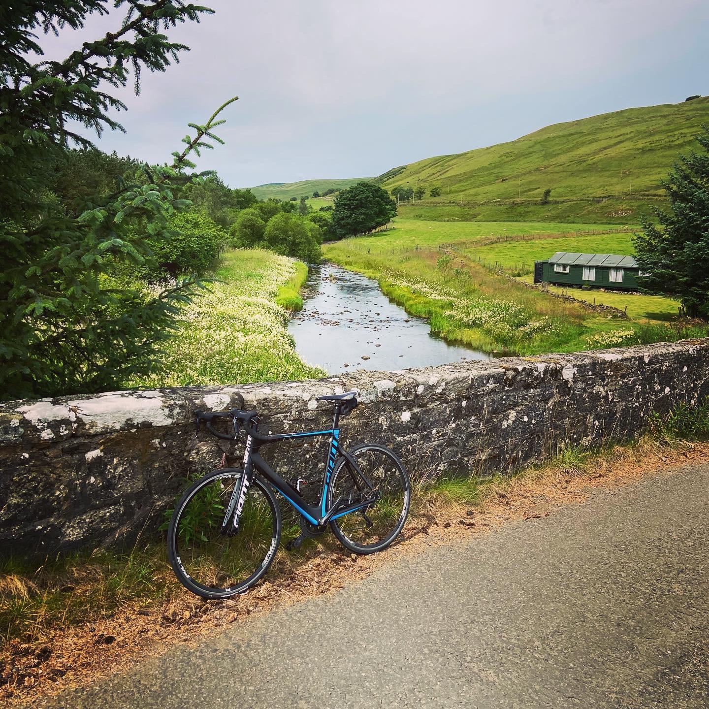 Bike on a bridge over a stream on the Tak ma Doon Road in Scotland. r