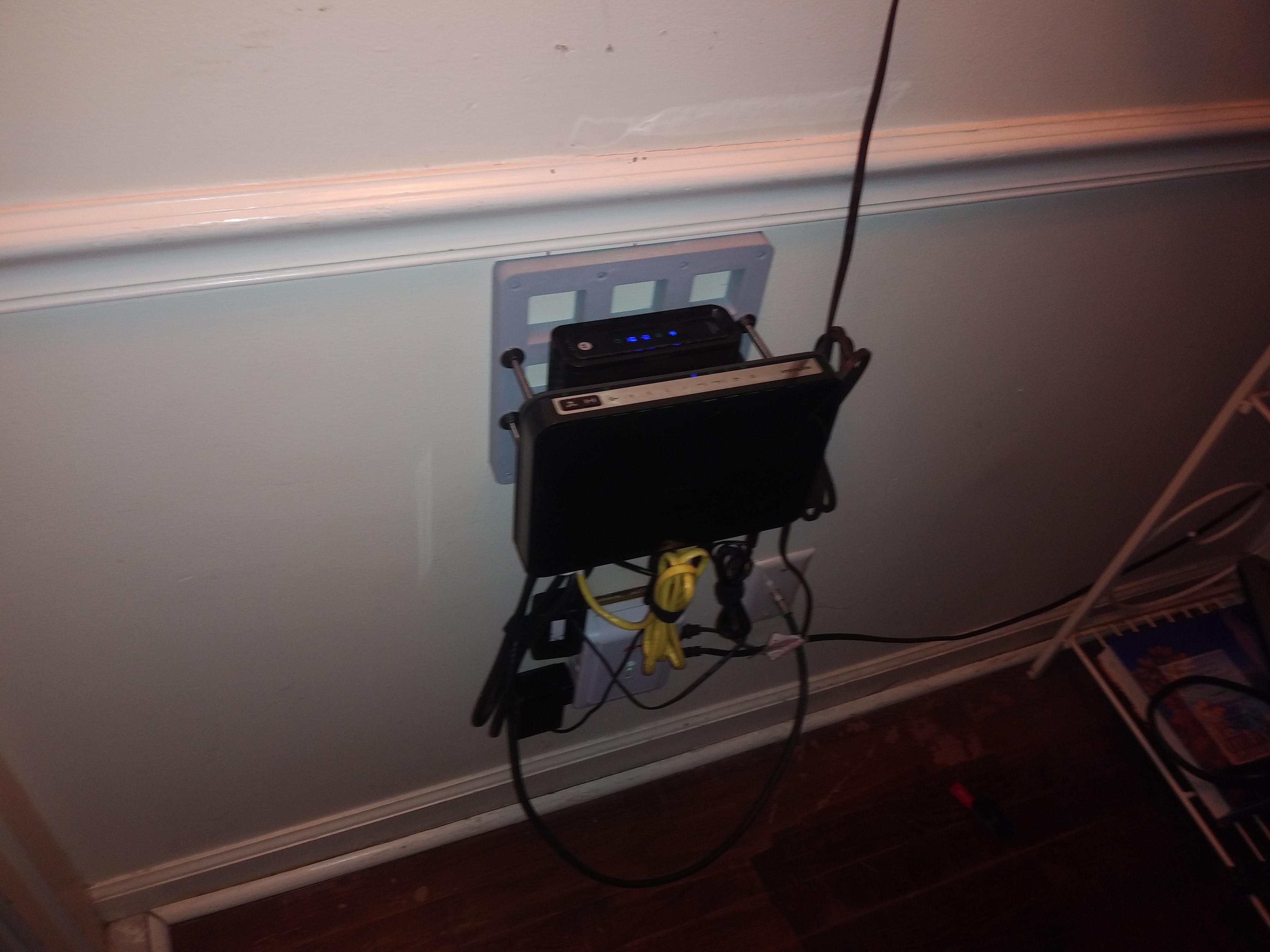 3d printed "rack", modem, SSD's, router, ordered new cables r/homelab