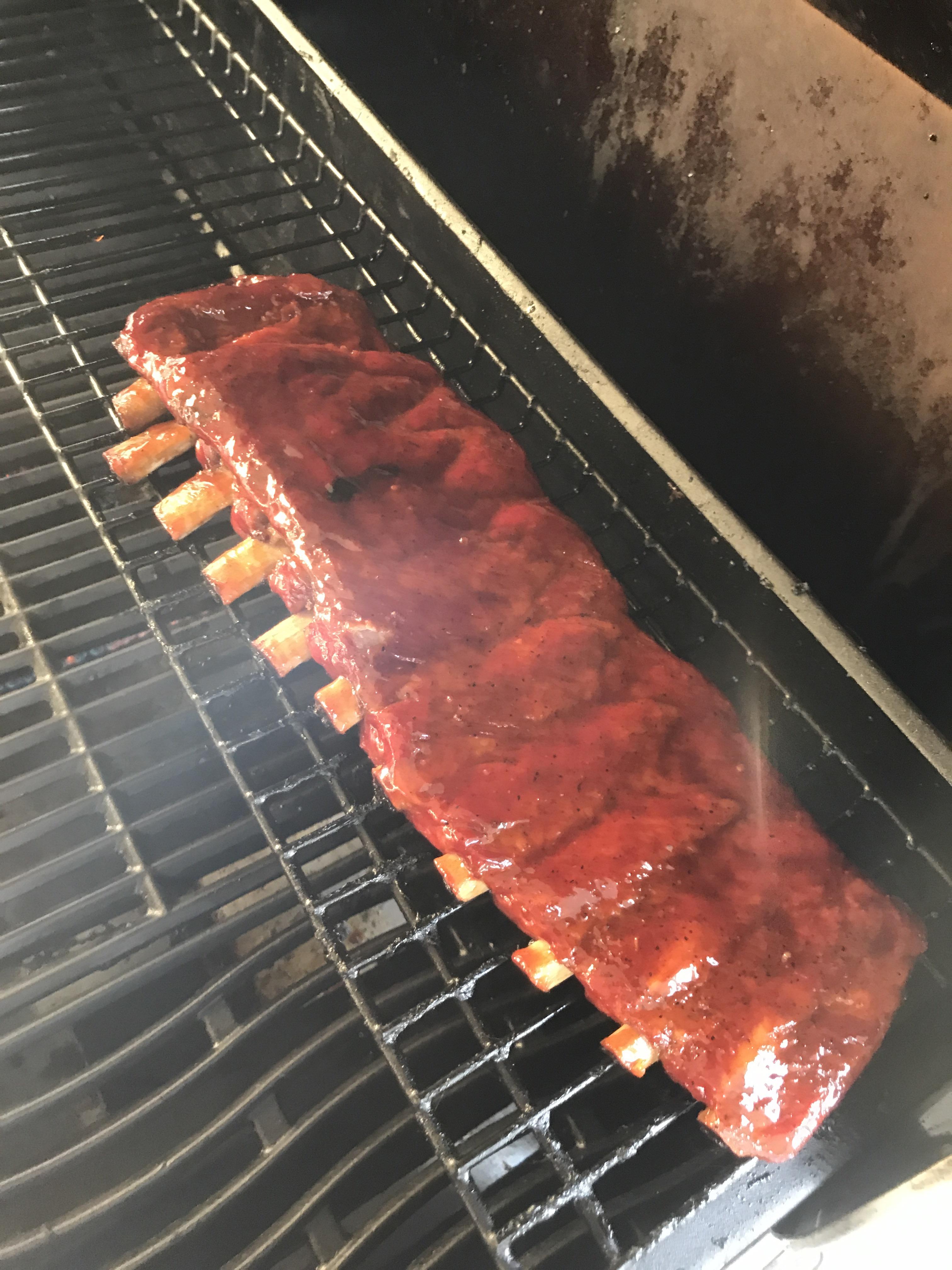 Finishing up a rack of St. Louis on the grill r/smoking