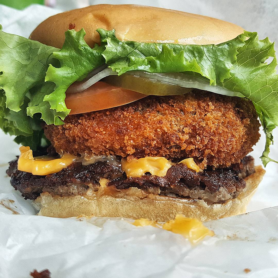[I ate] pankocrusted, cheddarstuffed portobello mushroom cheeseburger