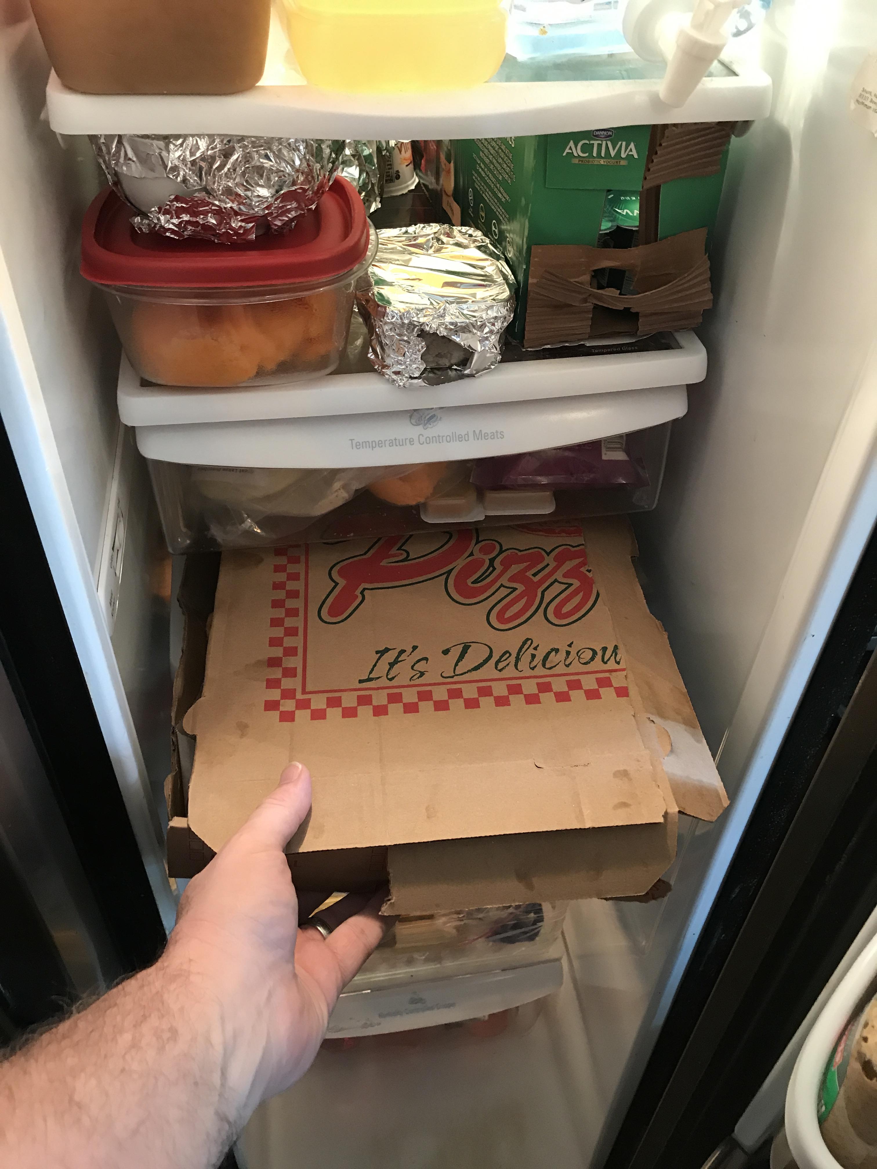 My girlfriend modified the pizza box to fit the fridge. Brilliant! r