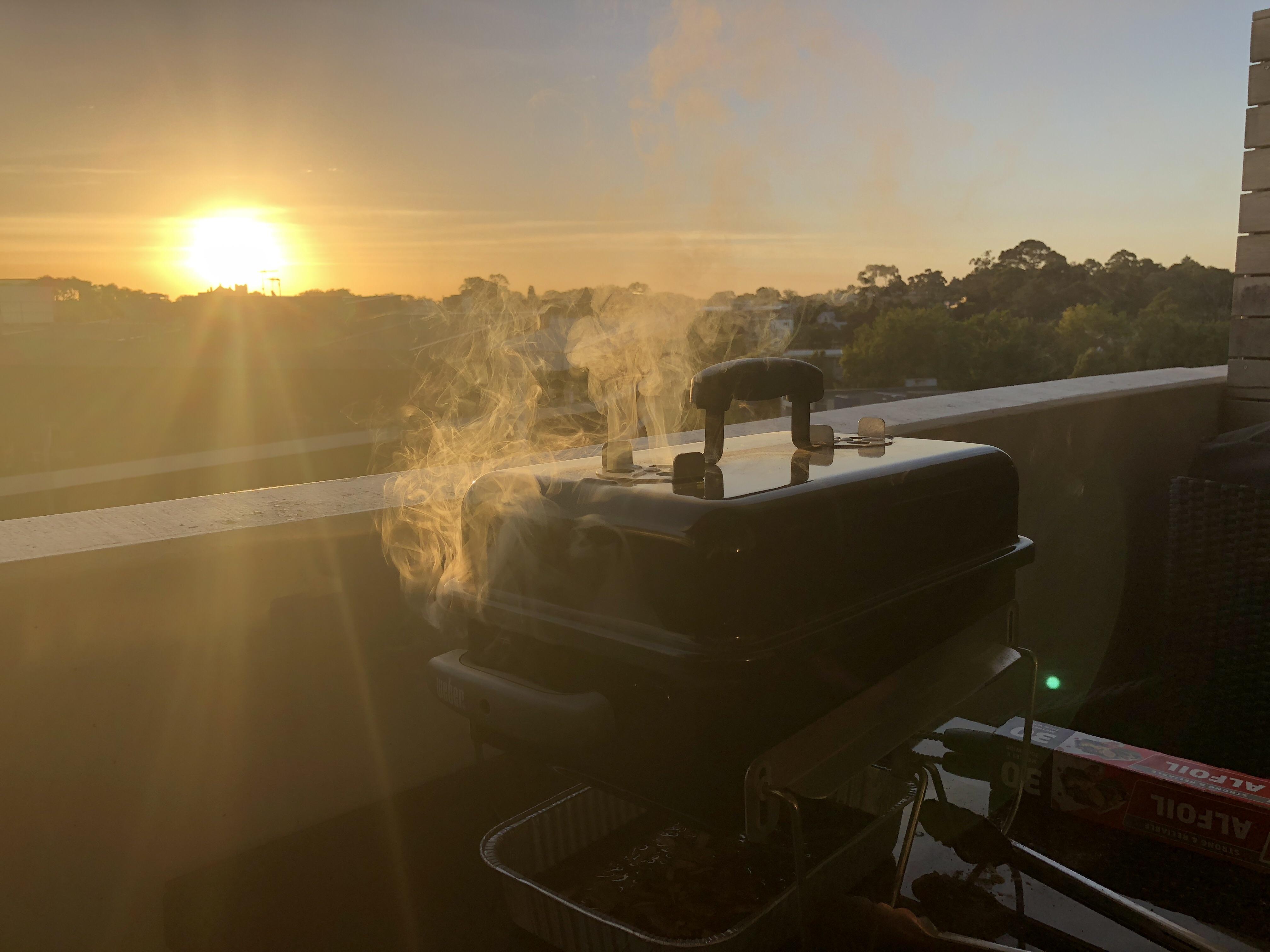 Sunset BBQ on my apartment balcony r/BBQ