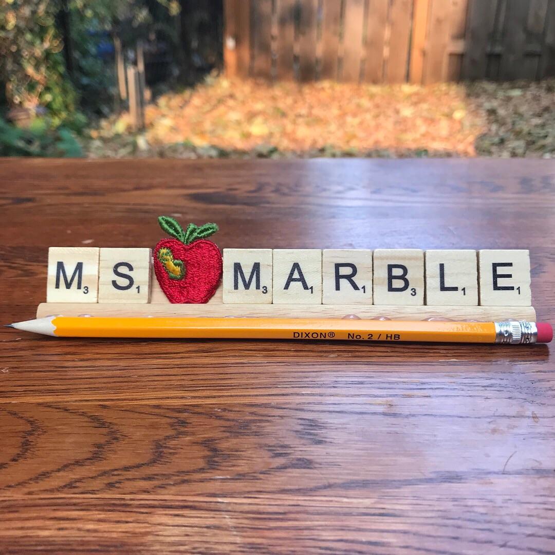 A teacher name plate I made out of Scrabble Tiles + holder r/crafts