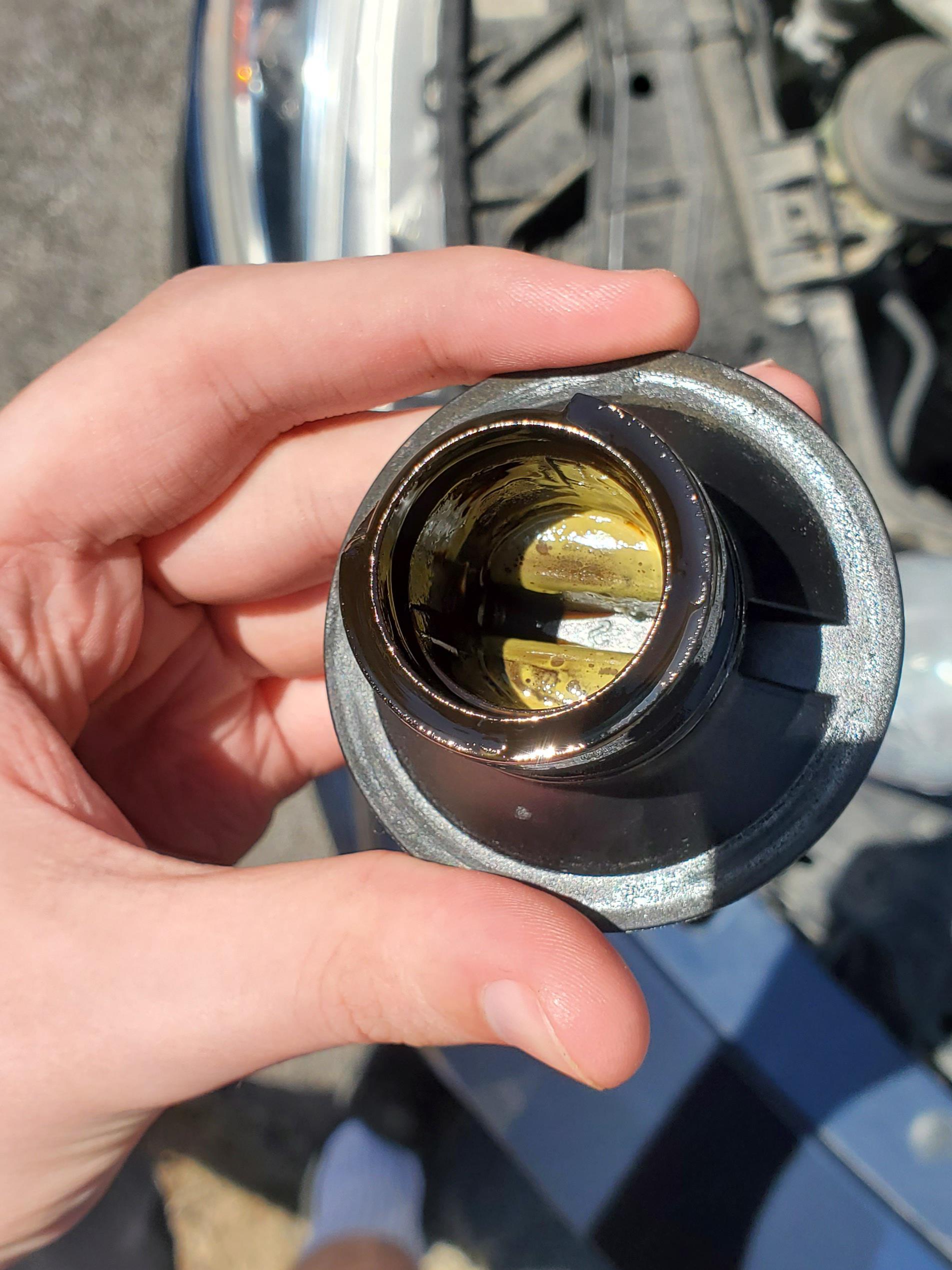 Whats the yellow stuff in my oil cap? (I changed my oil 300 miles ago