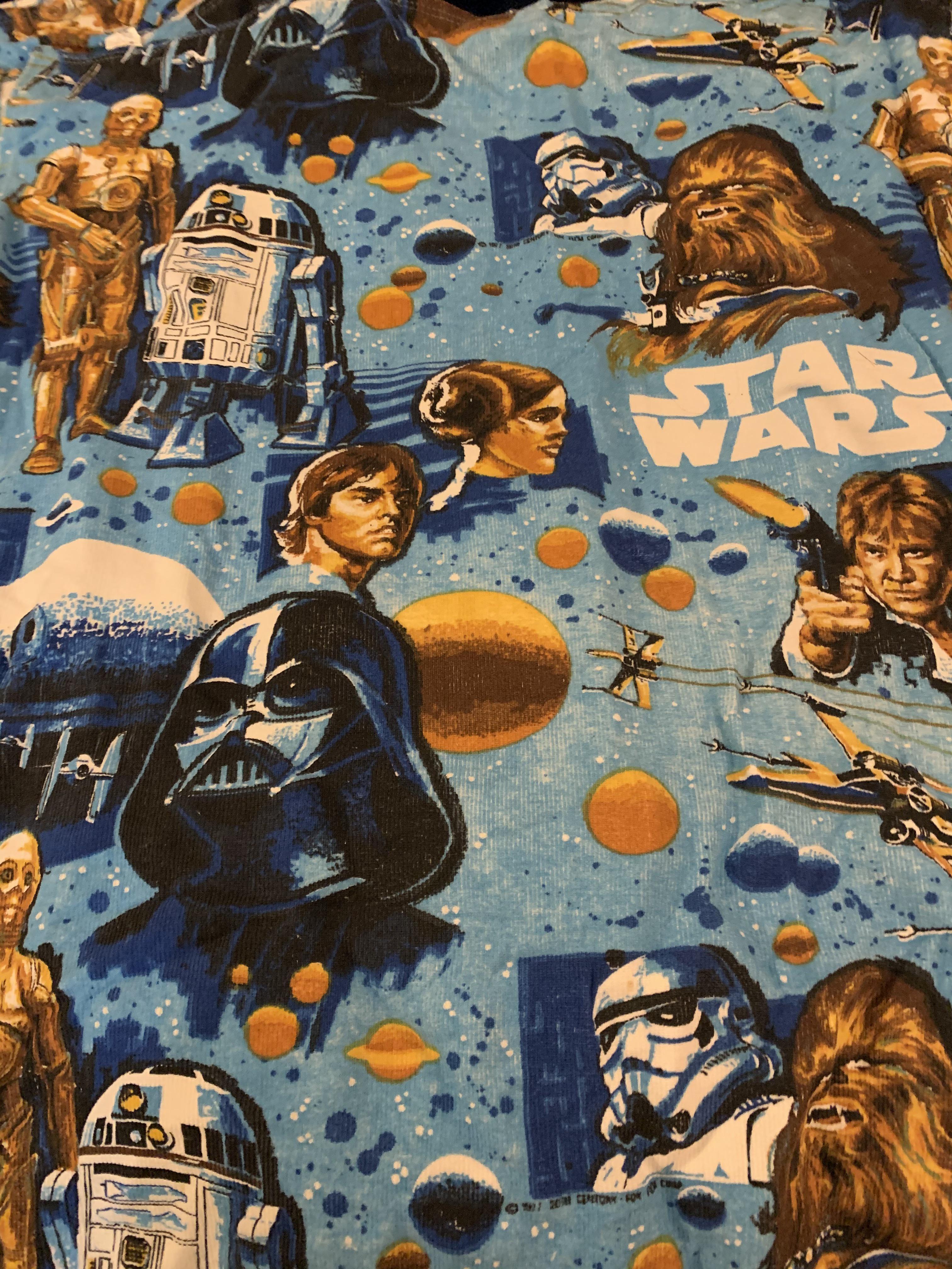 My husband's Star Wars blanket from 70's. Still in perfect shape! r