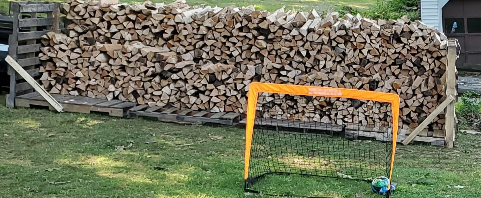 Tired of using tarps to cover my firewood thinking of a tin roof or