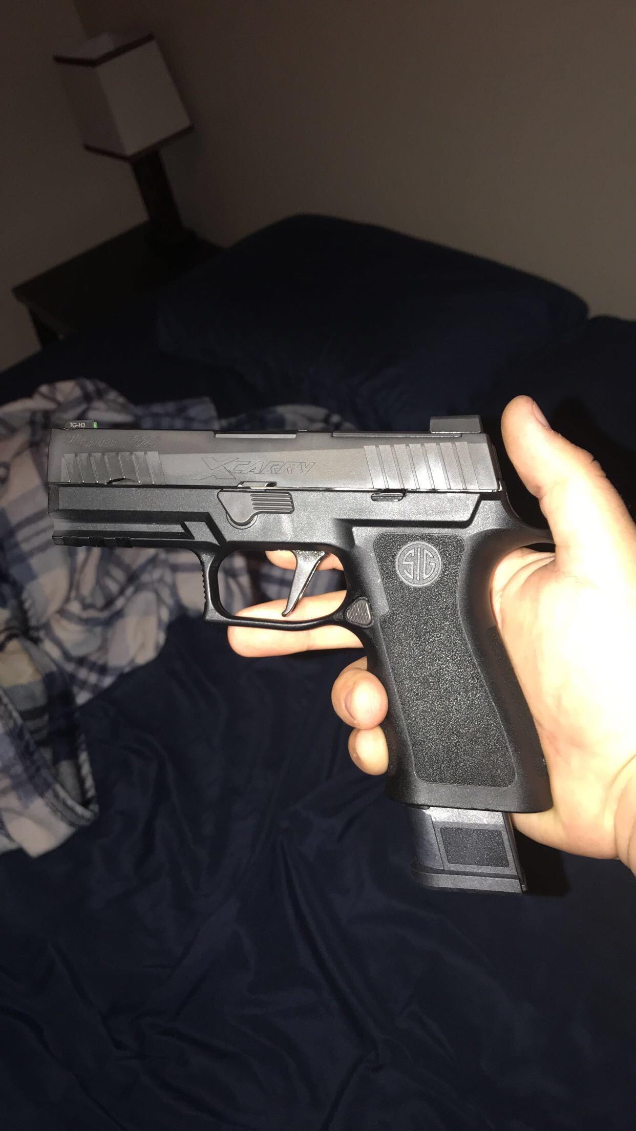 9mm Pistol On Bed