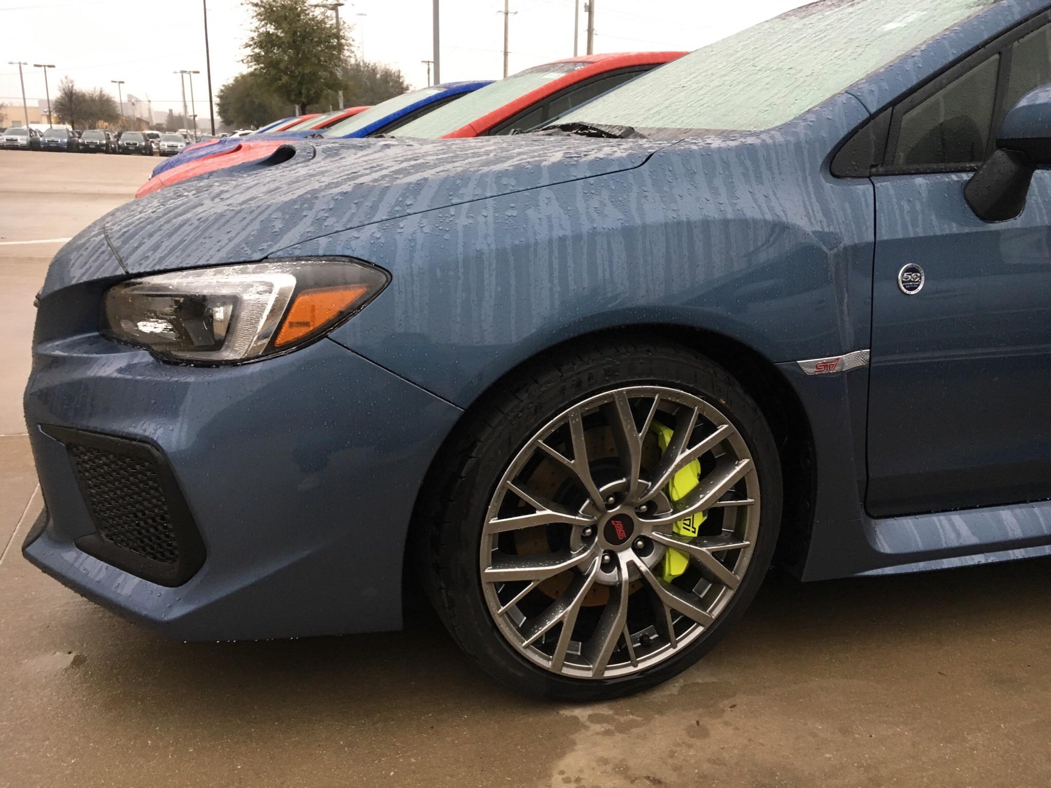Saw a 50th anniversary STI with highlighter yellow calipers at my local