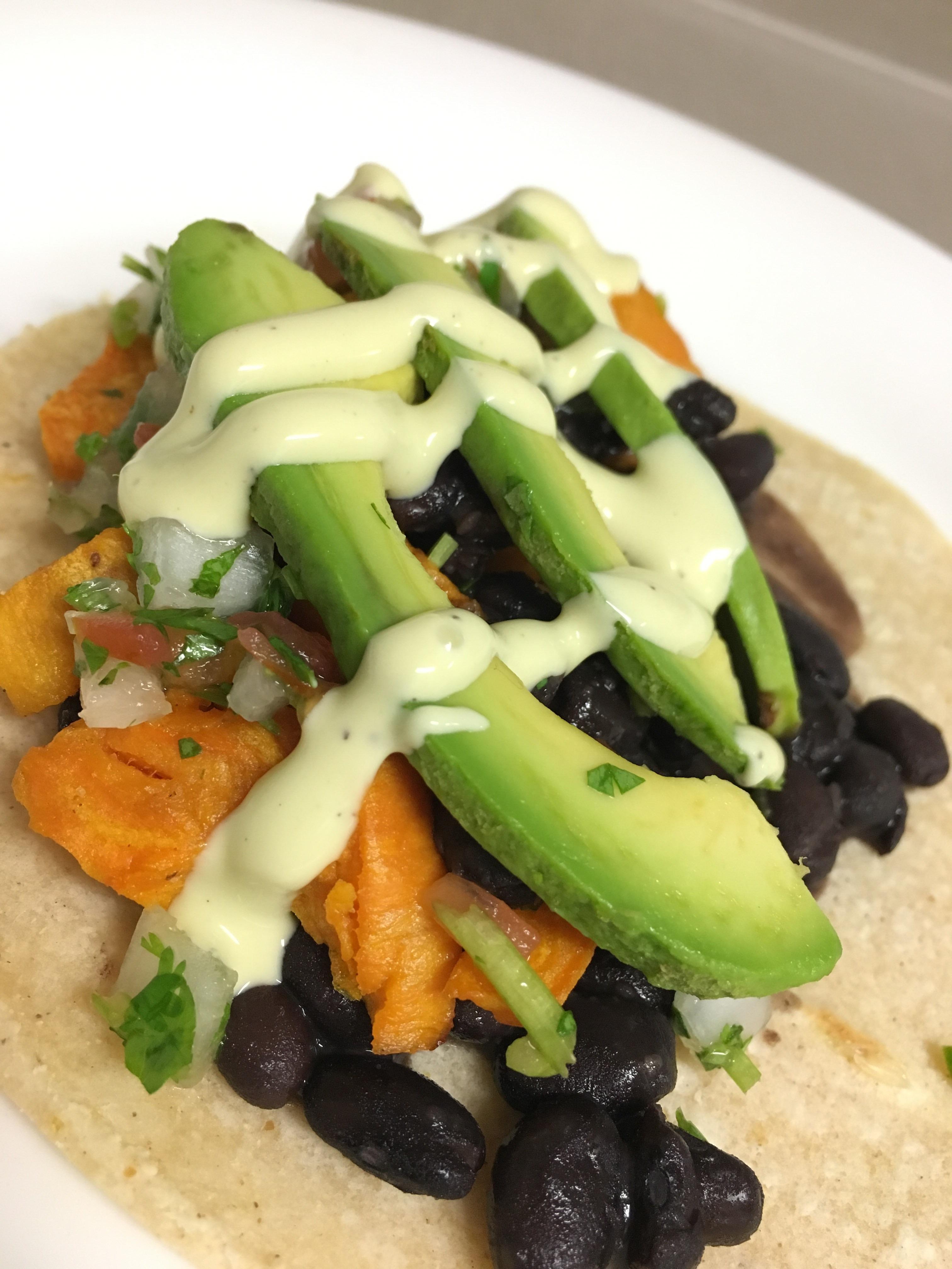 [I made] Sweet potatoes tacos with black beans, salsa, avocados and