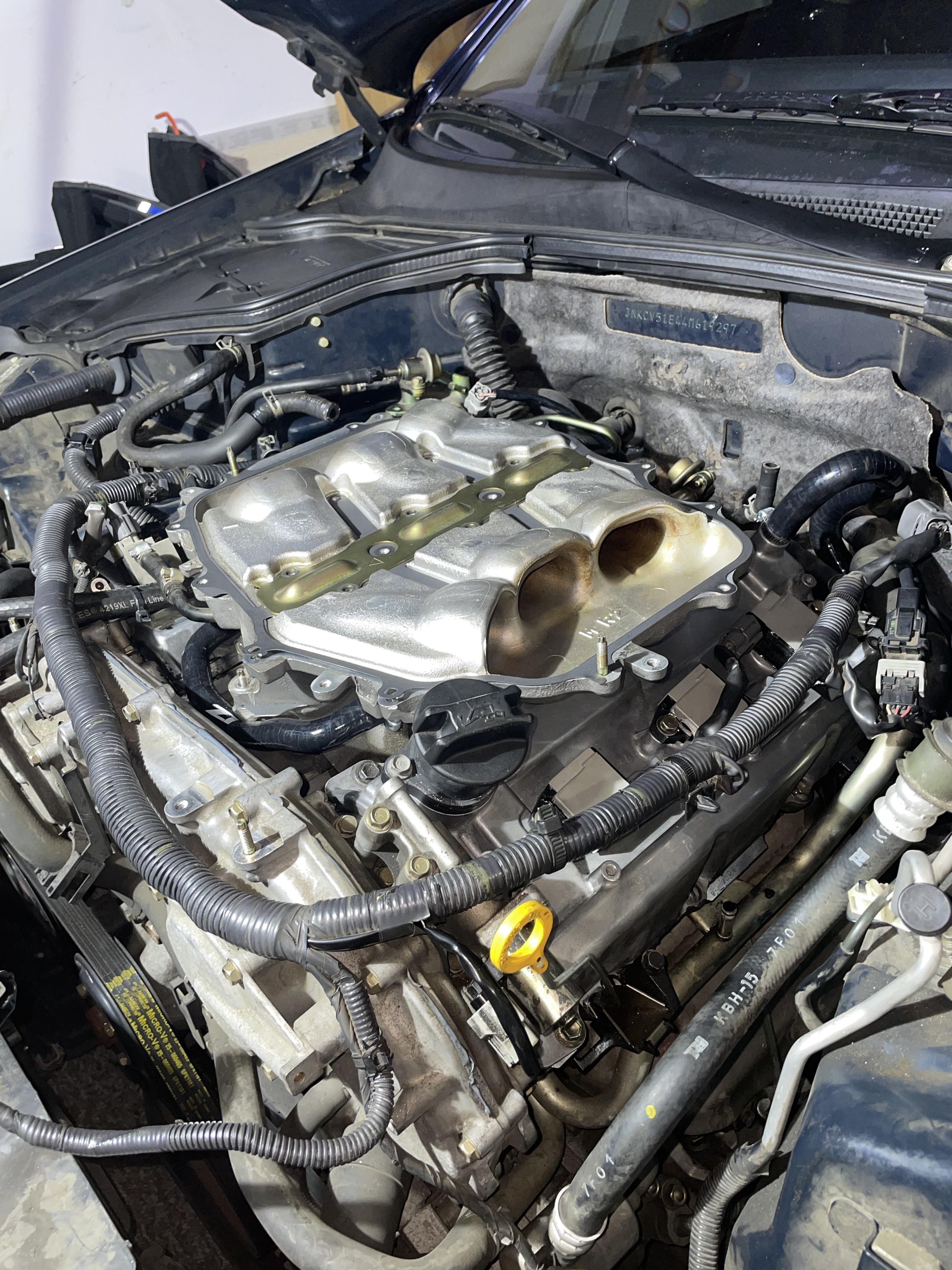 Aluminum valve covers with serviceable spark plug tube seals from a