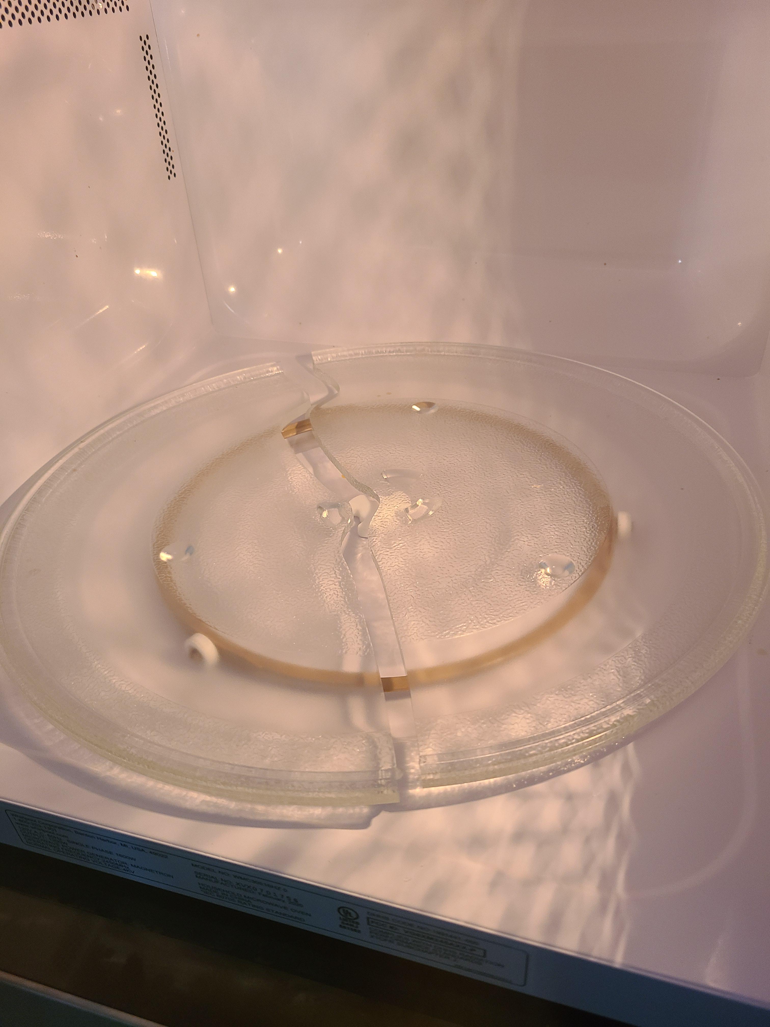 Halfway through popping a bag of popcorn and the plate broke. The microwave is a month old! r