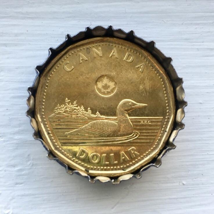 This Canadian Loonie inside a Bud Light cap Perfectfit