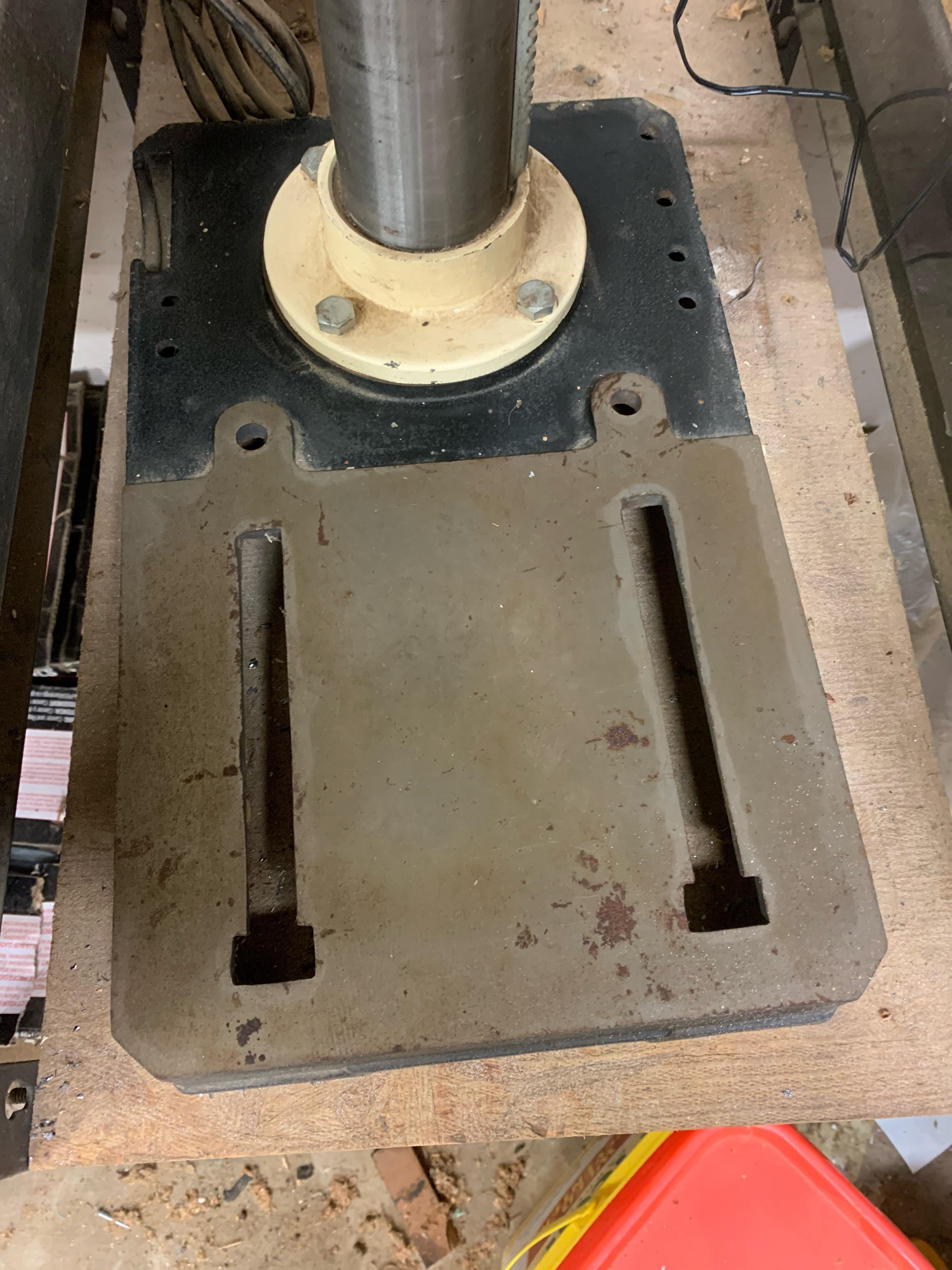 Why does a drill press have these slots on the base? What is the