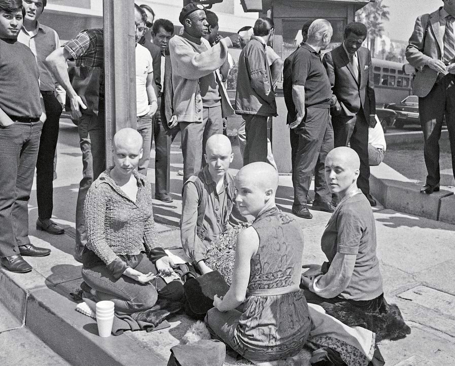 Four of Charles Manson's followers kneeling outside the Los Angeles