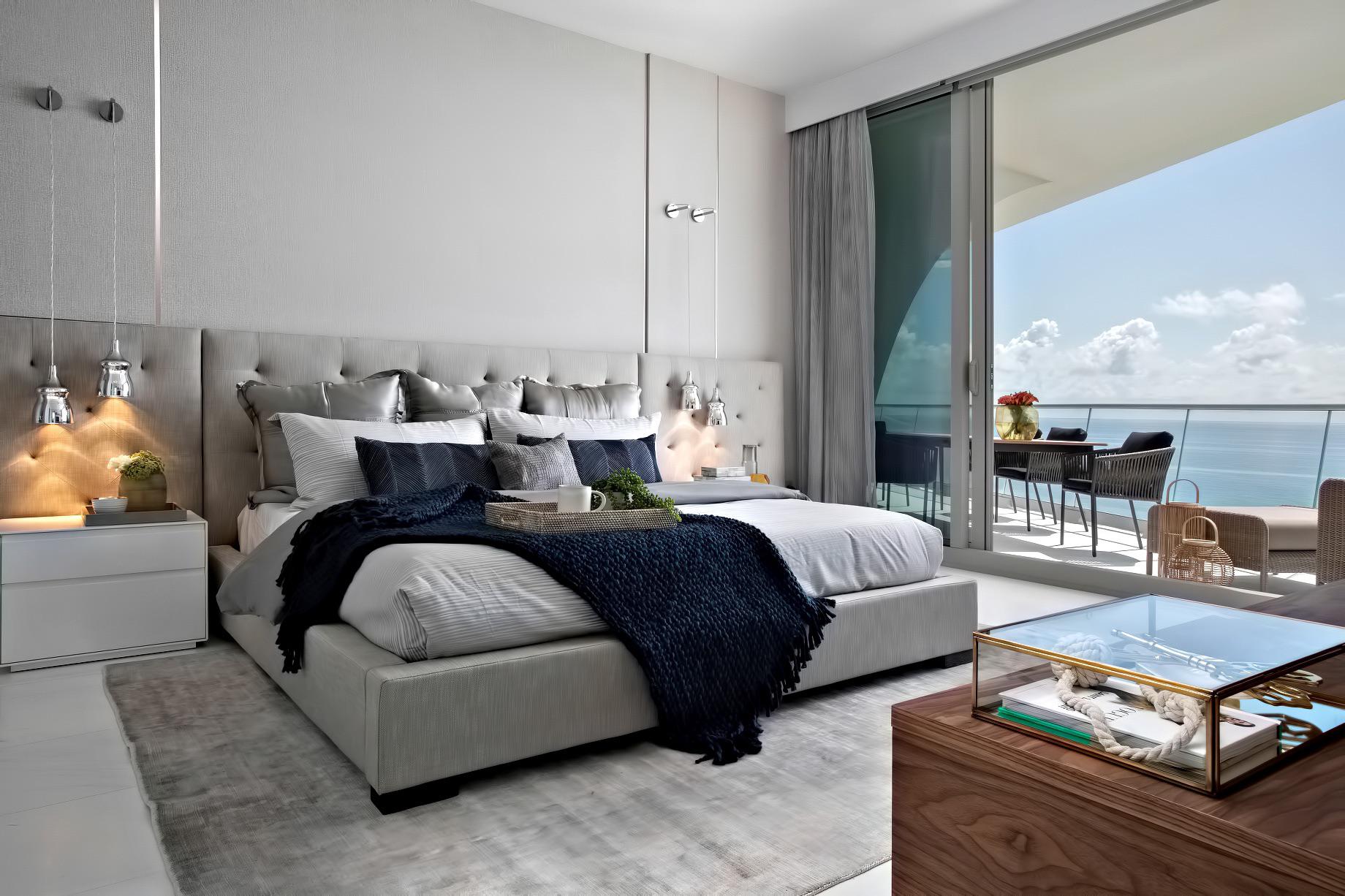 Comfy oceanfront master bedroom by Dkor Interiors Sunny Isles Beach