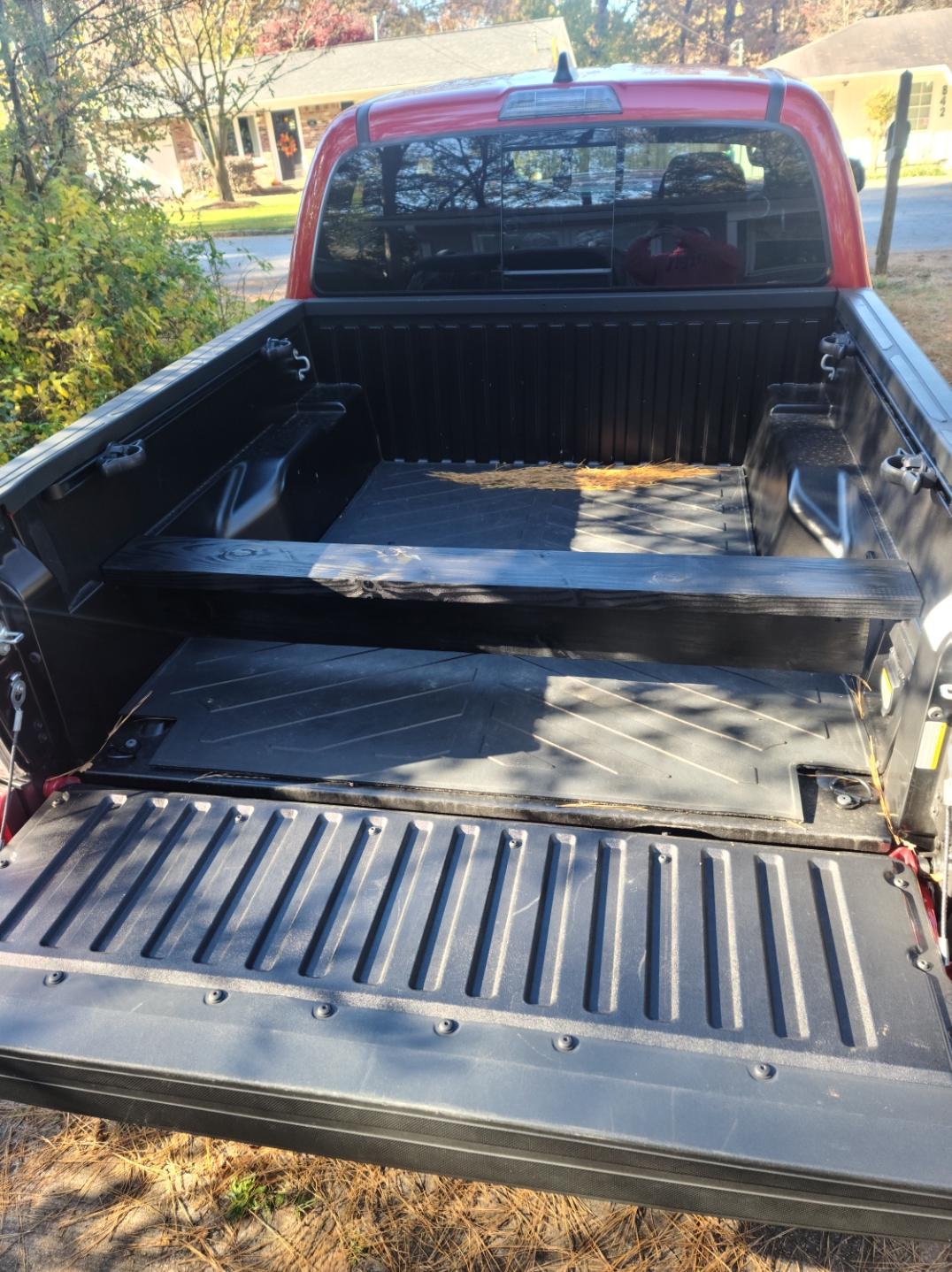 Simple bed divider using 2x6 planks screwed together. Perfect for small