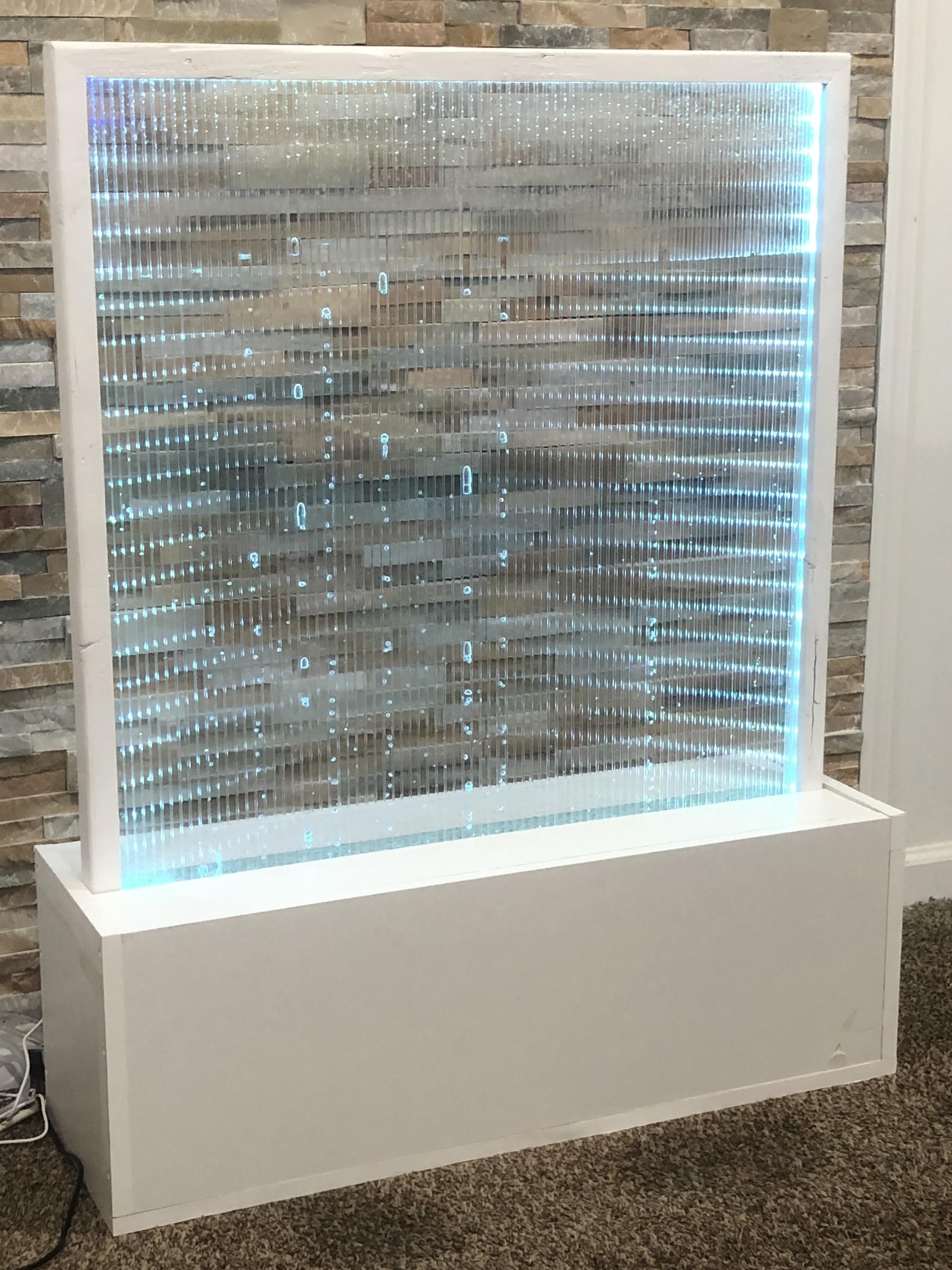 Made a water bubble wall and added LEDs to the side to spice it up r/led