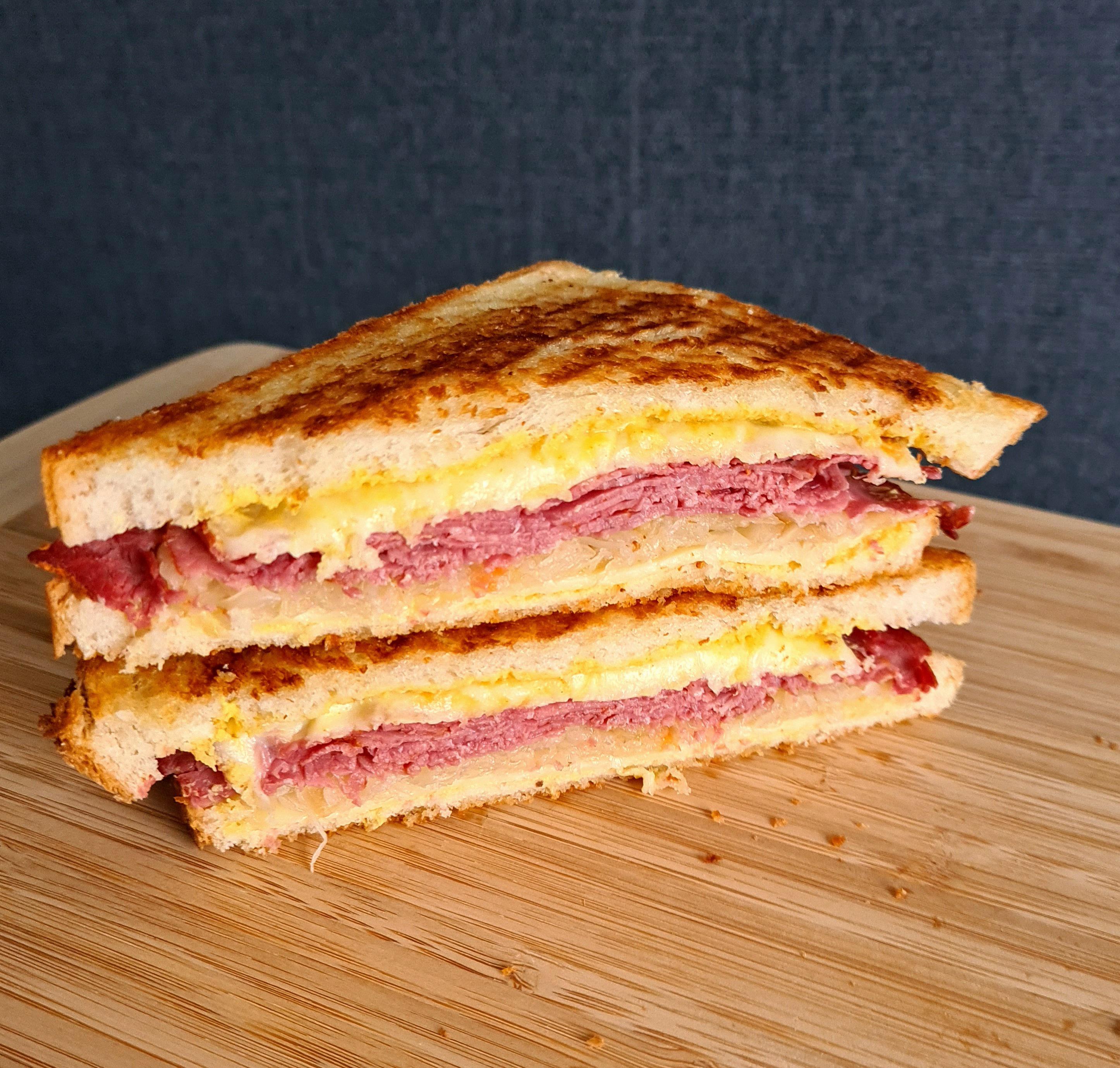 Pastrami, Swiss, sauerkraut, dijon mustard, on toasted sourdough. r