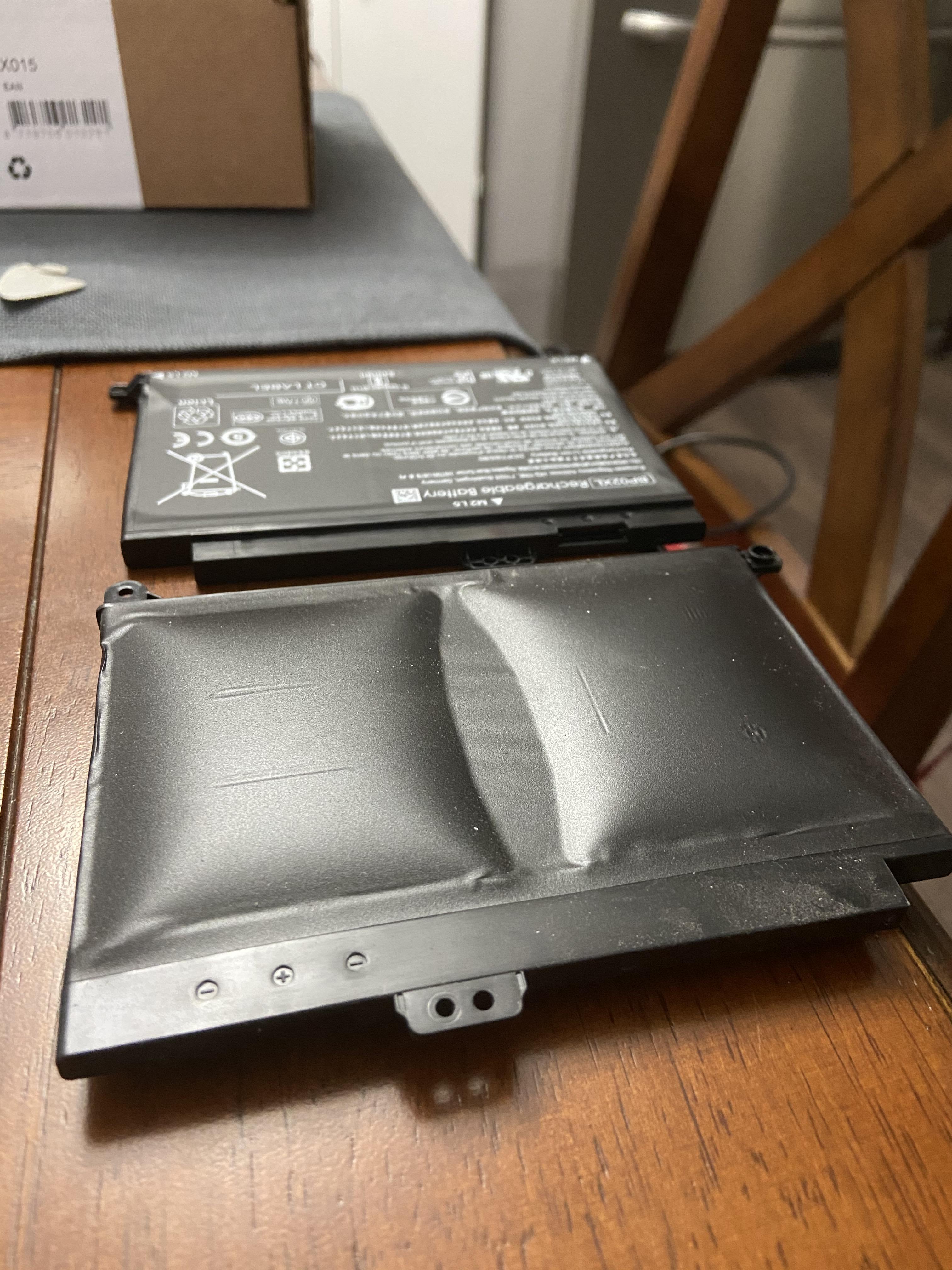 HP laptop battery replacement, new one in the back for comparison. r