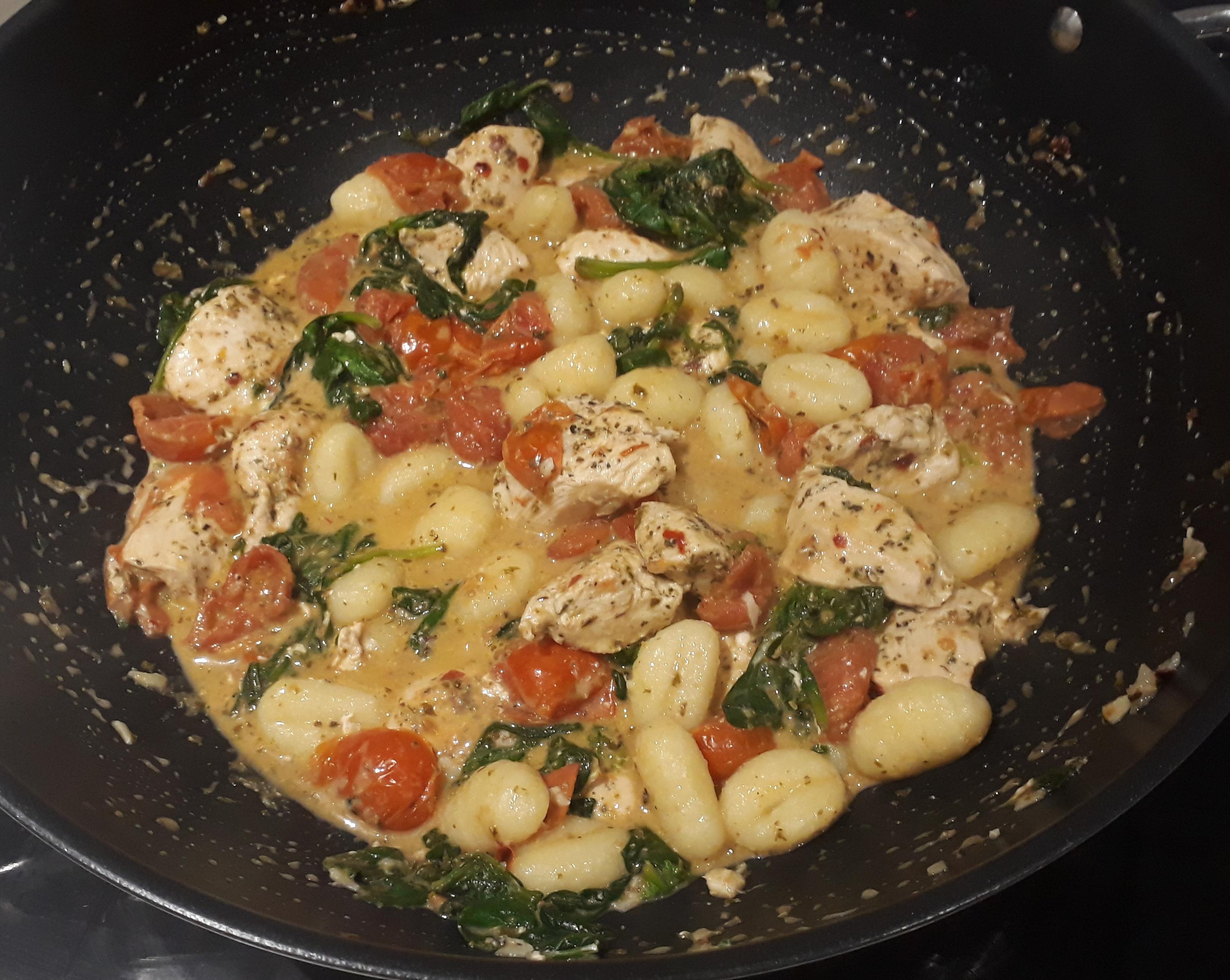 Gnocchi with herby chicken, roast cherry tomatoes, spinach and lotsa