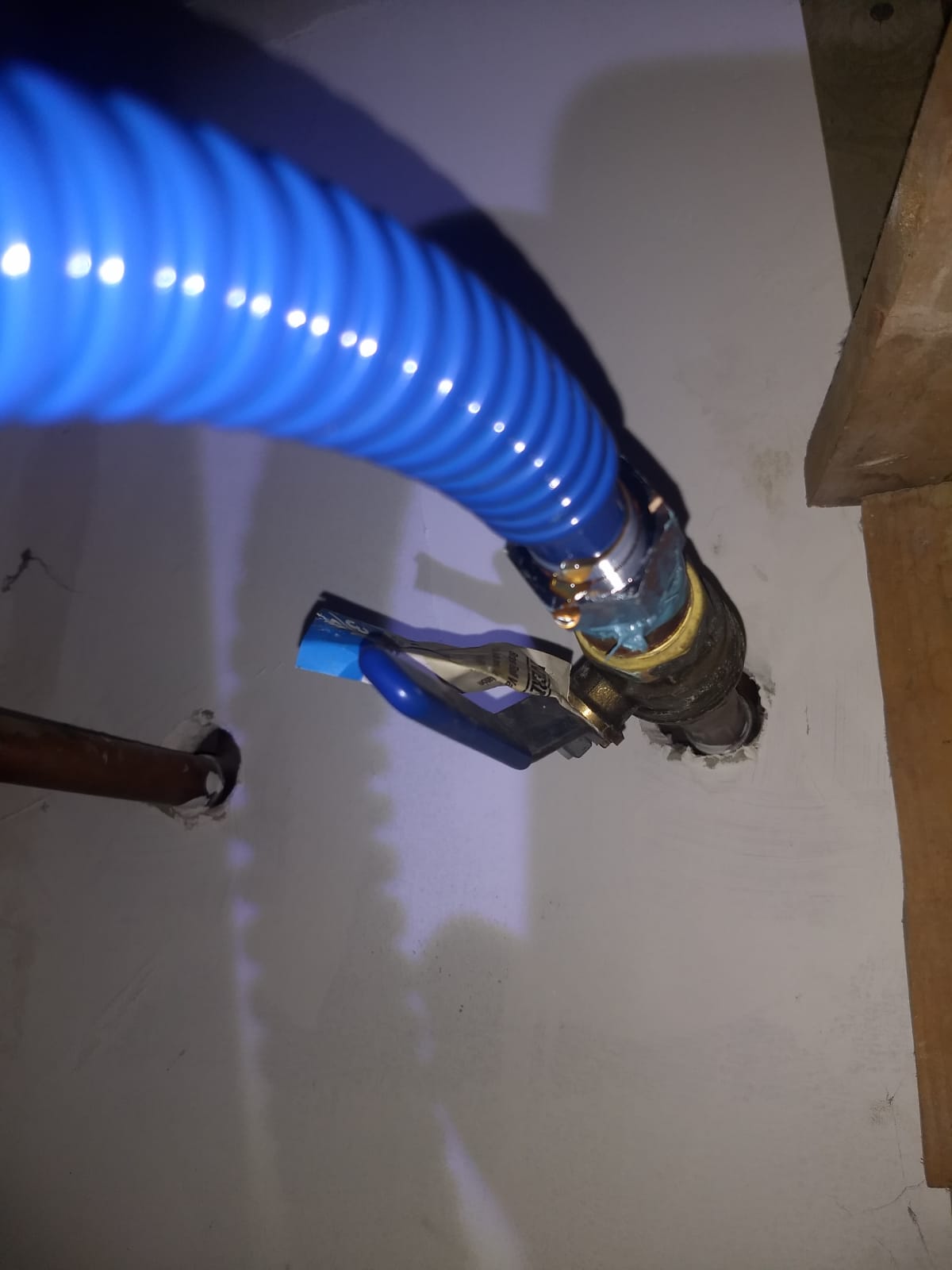 Can I fix this dripping pipe myself by tightening the valve? Plumber changed the pipe in the