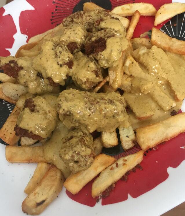 Deep fried seitan and homemade fries smothered in a curry sauce r/vegan