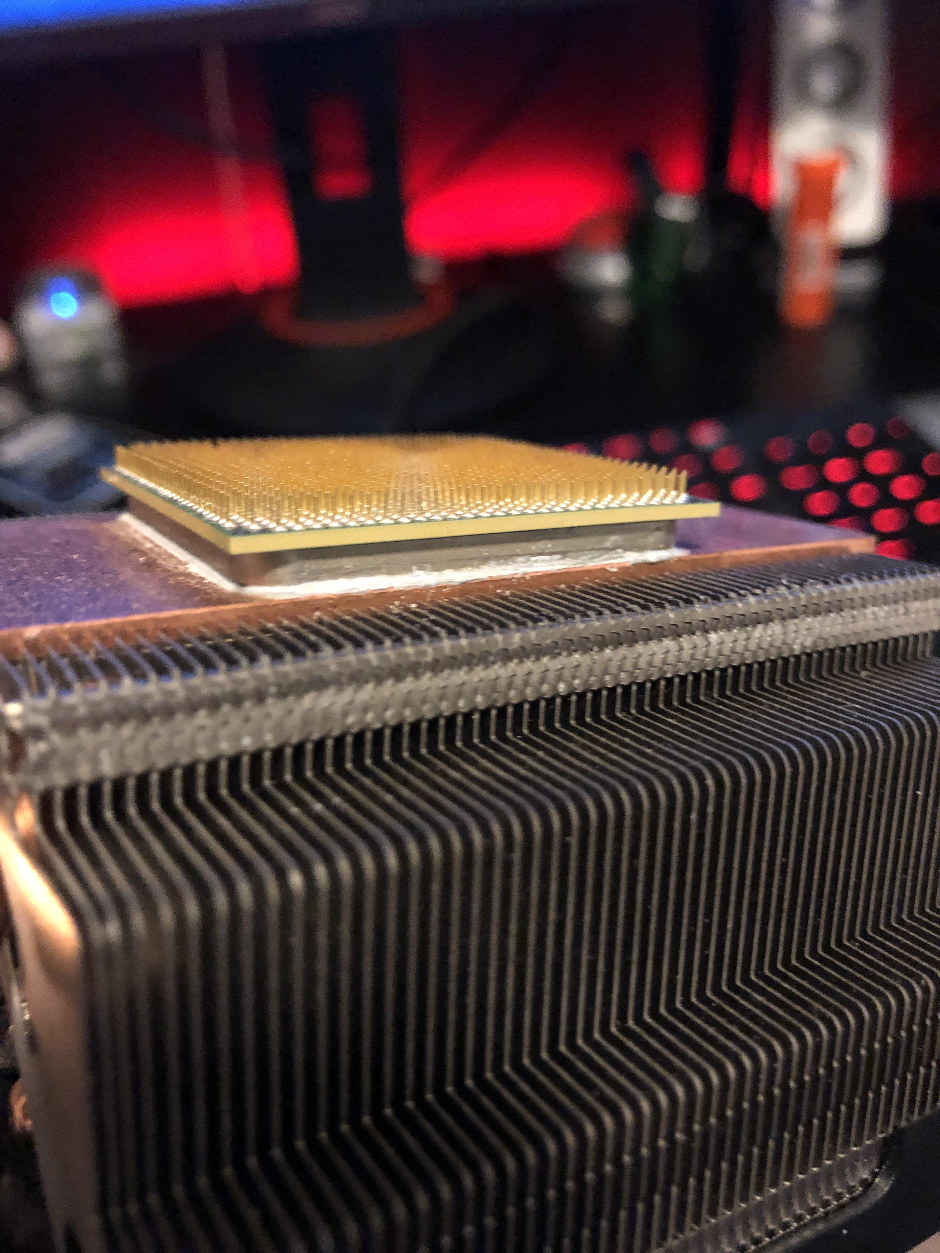 This CPU is stuck to its heatsink and I have no idea how to get it off